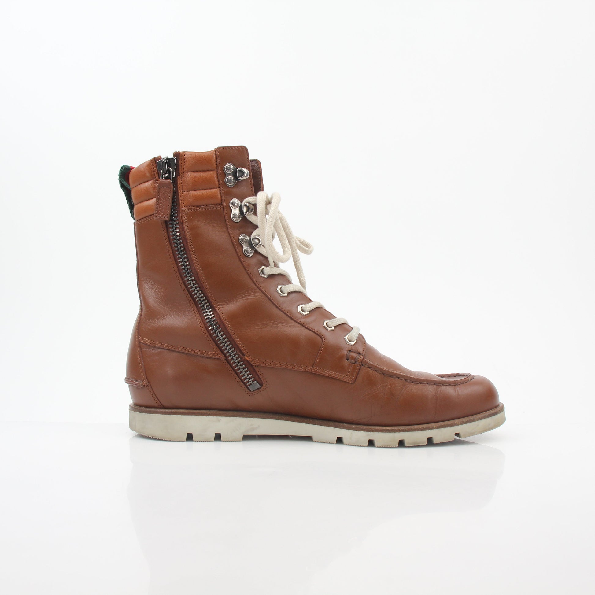 Gucci brown leather web accent hiking boots with rugged soles and stylish design, featuring gold and beyond branding.
