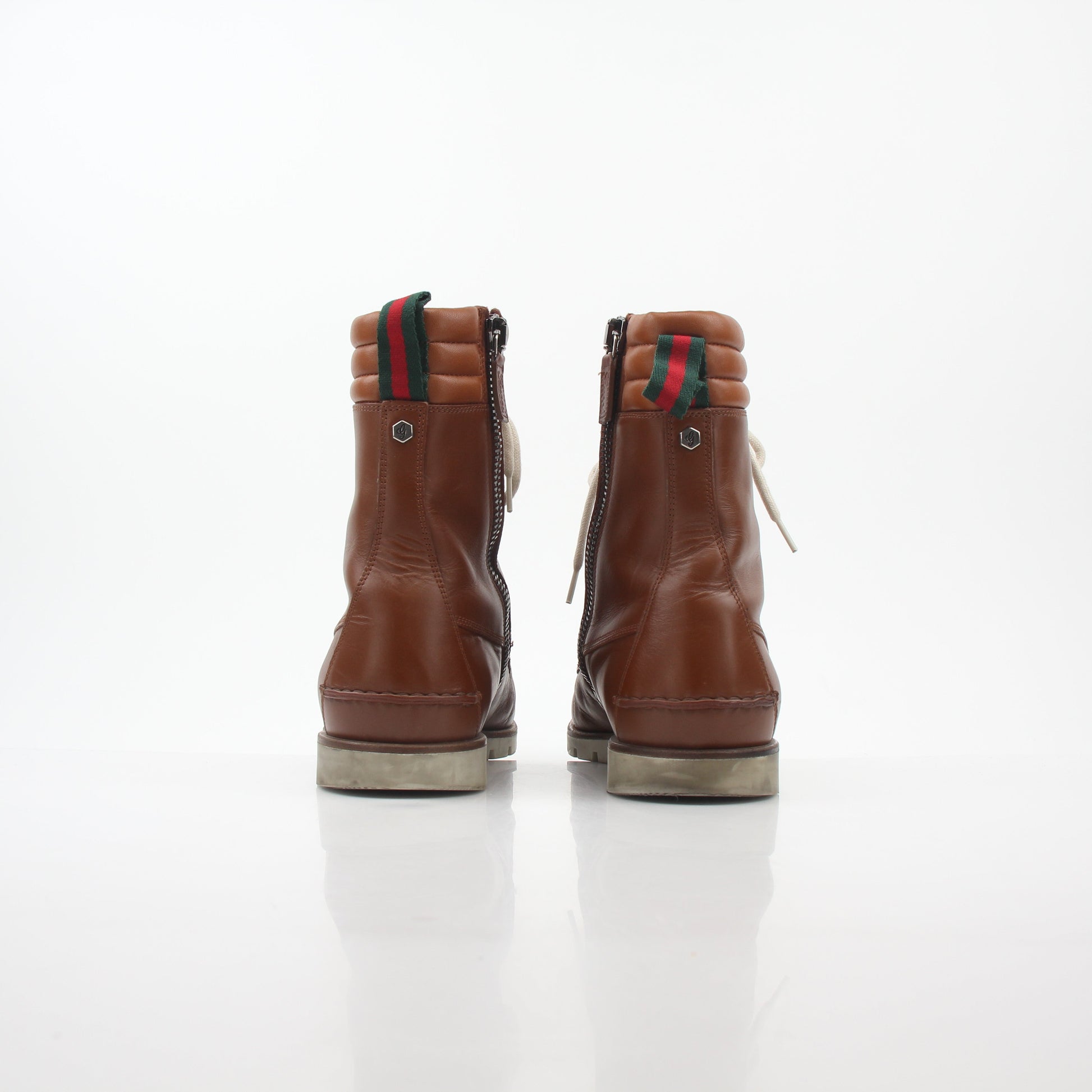 Gold & Beyond Gucci brown leather hiking shoes with Web accents, sturdy soles, and a stylish, rugged design.
