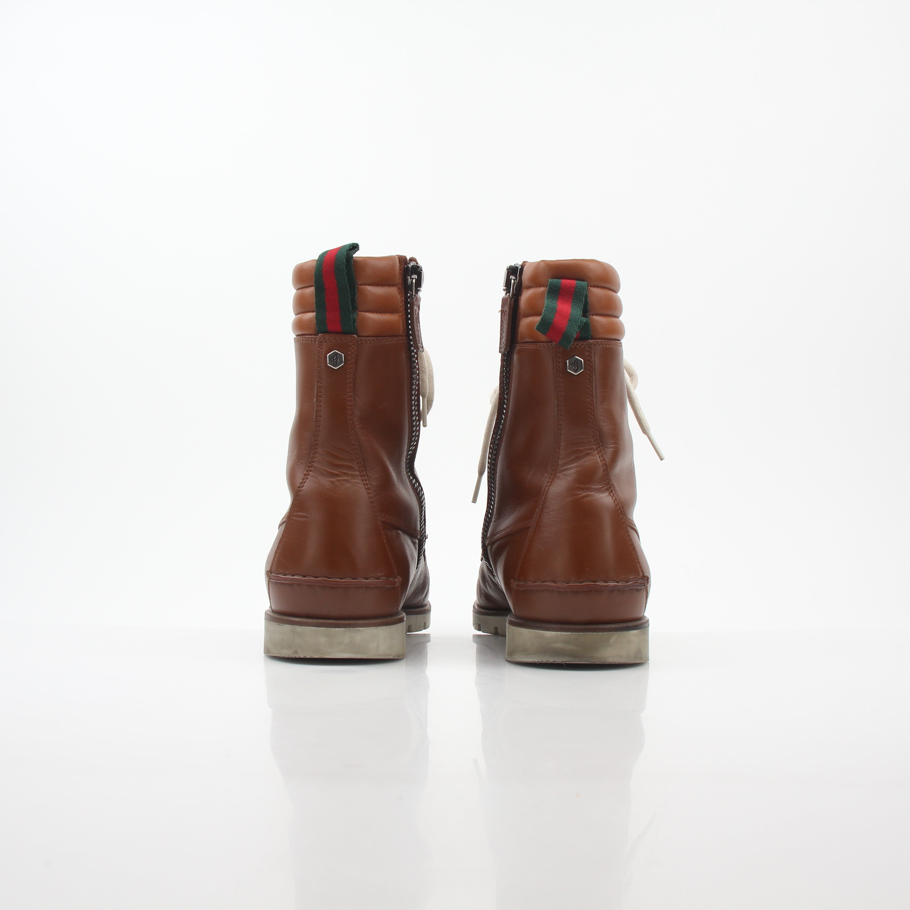 Gold & Beyond Gucci brown leather hiking shoes with Web accents, sturdy soles, and a stylish, rugged design.
