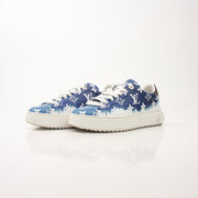 Louis Vuitton Women’s Time Out Sneakers by Gold & Beyond, white shoes with Louis Vuitton branding and stylish design, close-up view