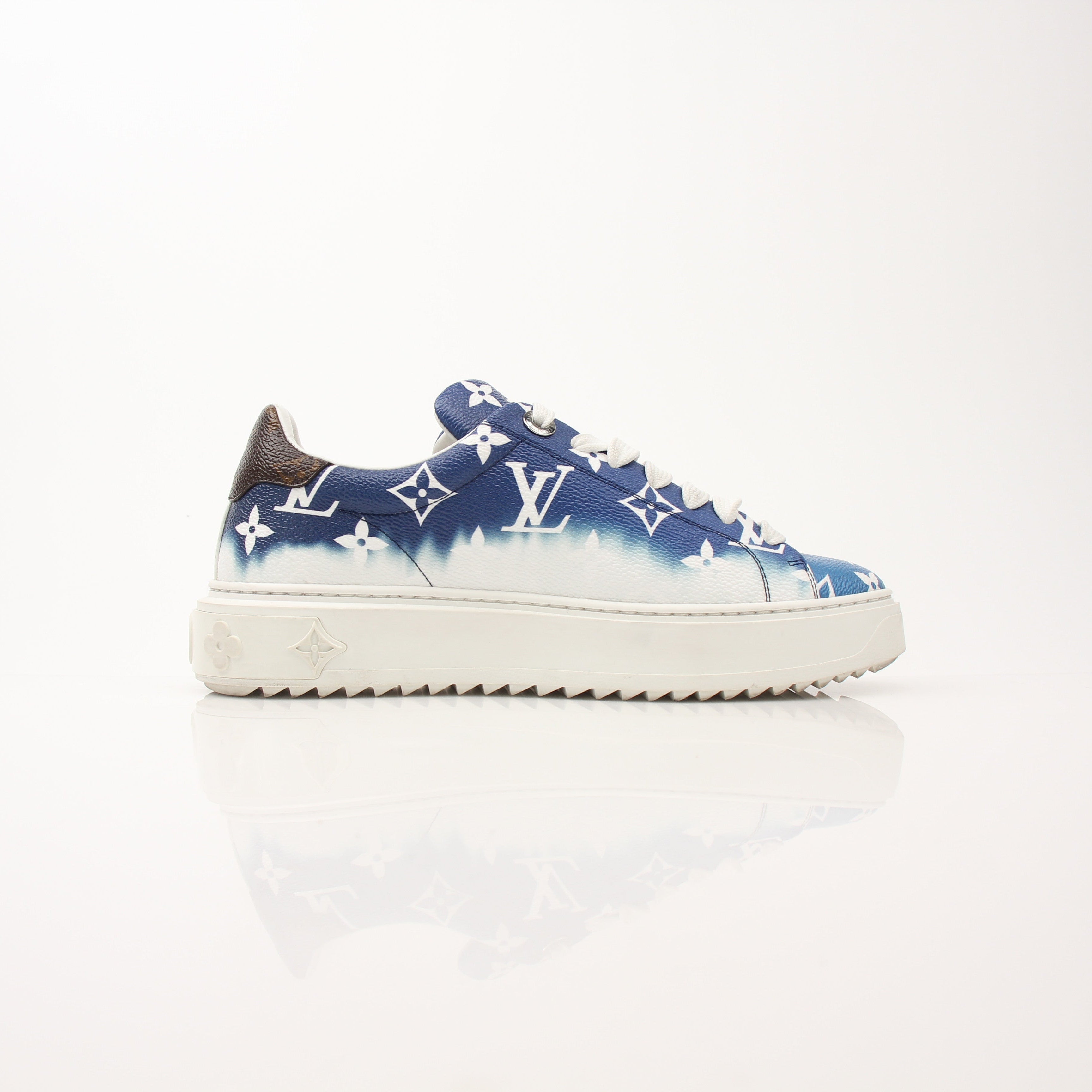 Louis Vuitton Women’s Time Out Sneakers by Gold & Beyond, stylish white and beige shoes with Louis Vuitton branding.