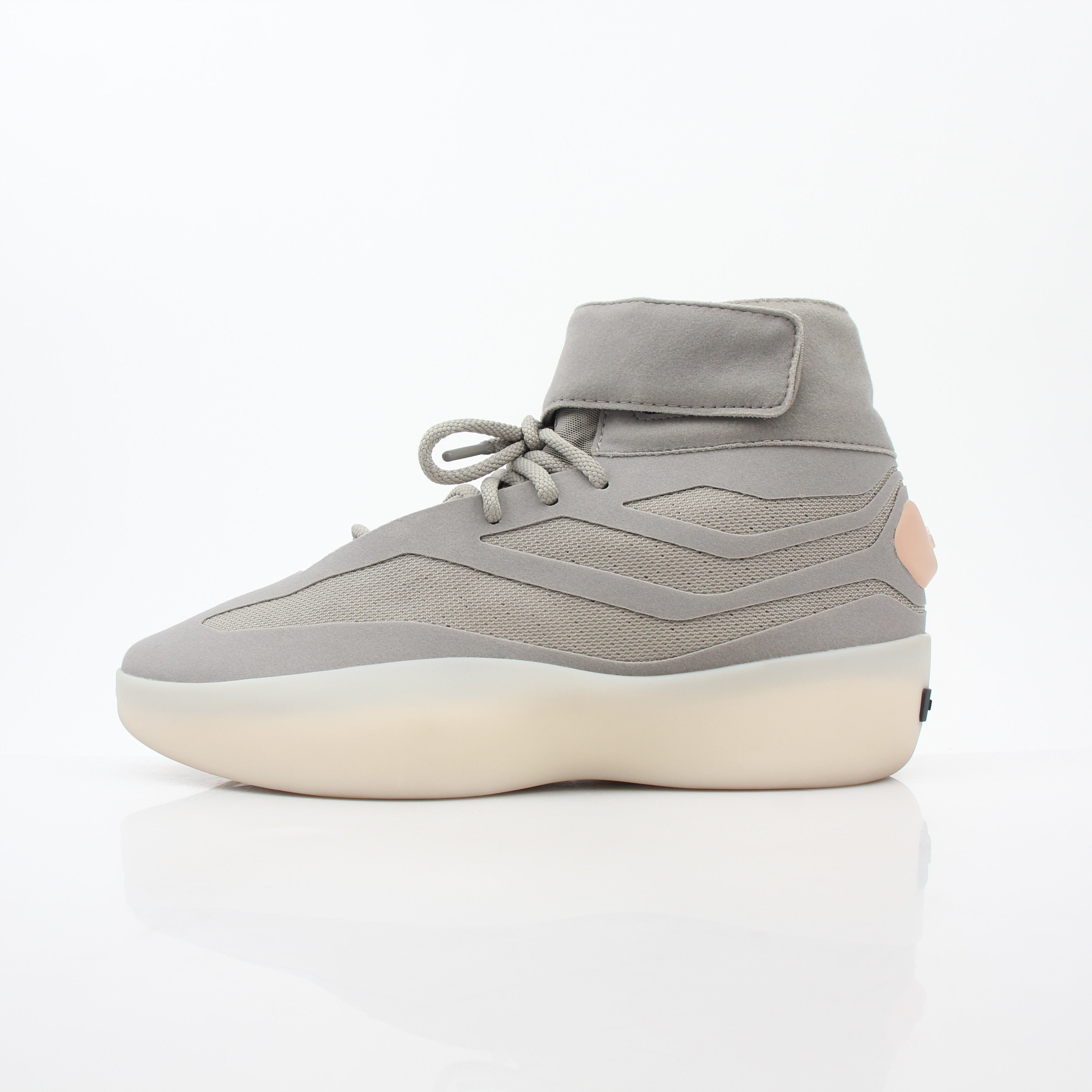 Adidas x Fear of God Putty Beige Athletics II basketball sneakers with high-top design and beige color, displayed on a white background.
