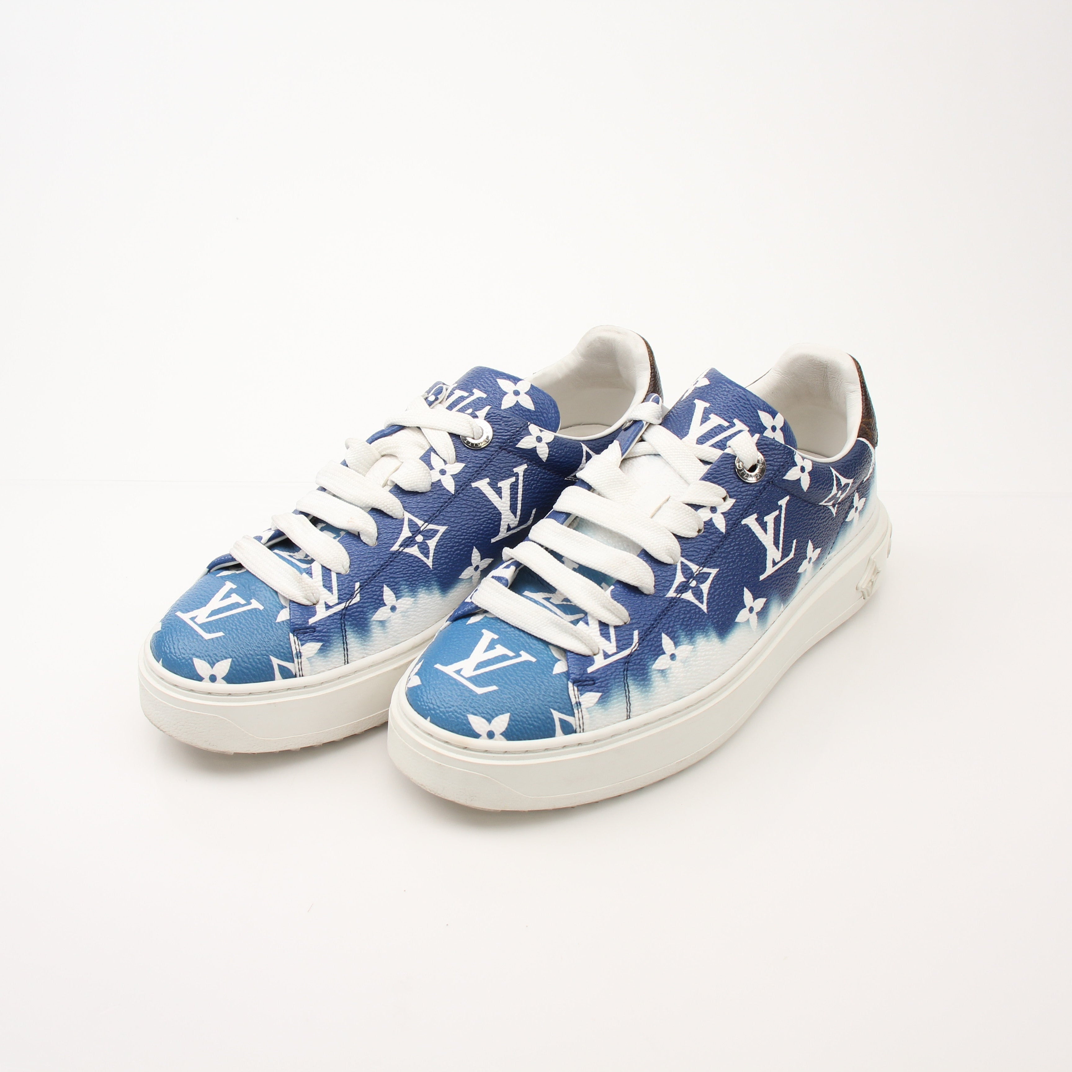 Gold & Beyond Louis Vuitton women’s Time Out sneakers featuring stylish design and comfortable shoes for casual wear.