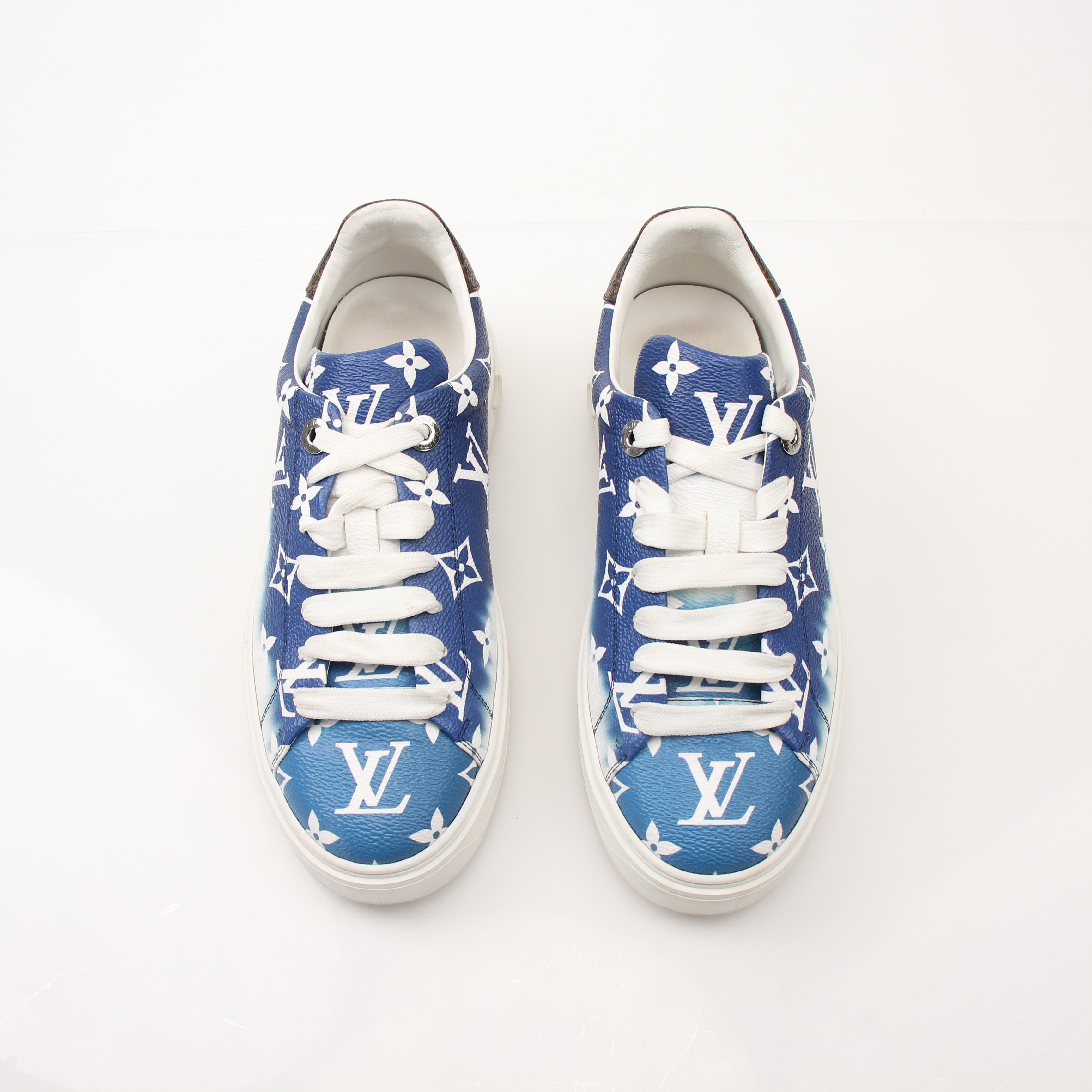 Louis Vuitton Women’s Time Out Sneakers by Gold & Beyond, stylish white shoes with Louis Vuitton branding and sporty design.