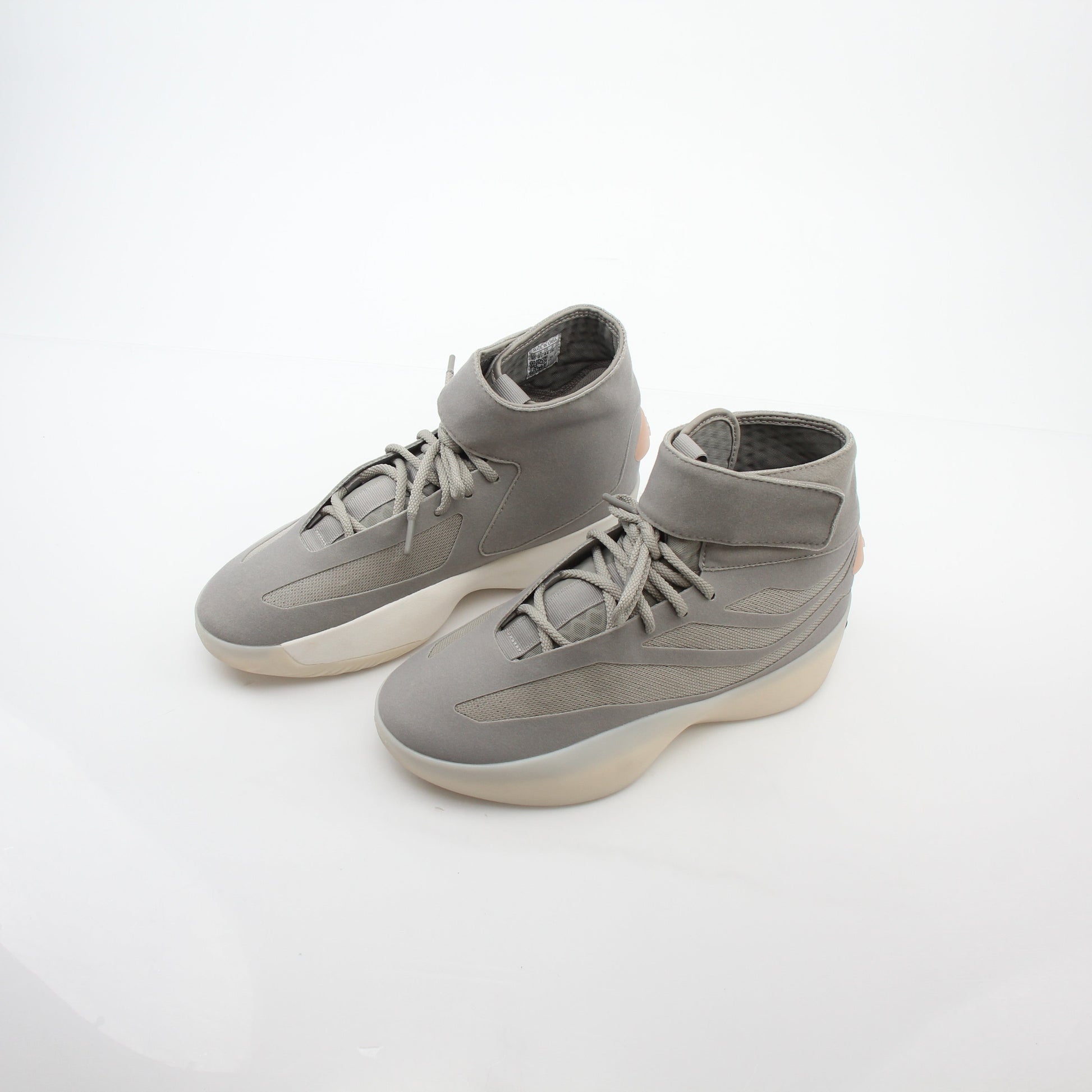 Adidas x Fear of God Putty Beige Athletics II basketball sneakers with high-top design and gold accents.