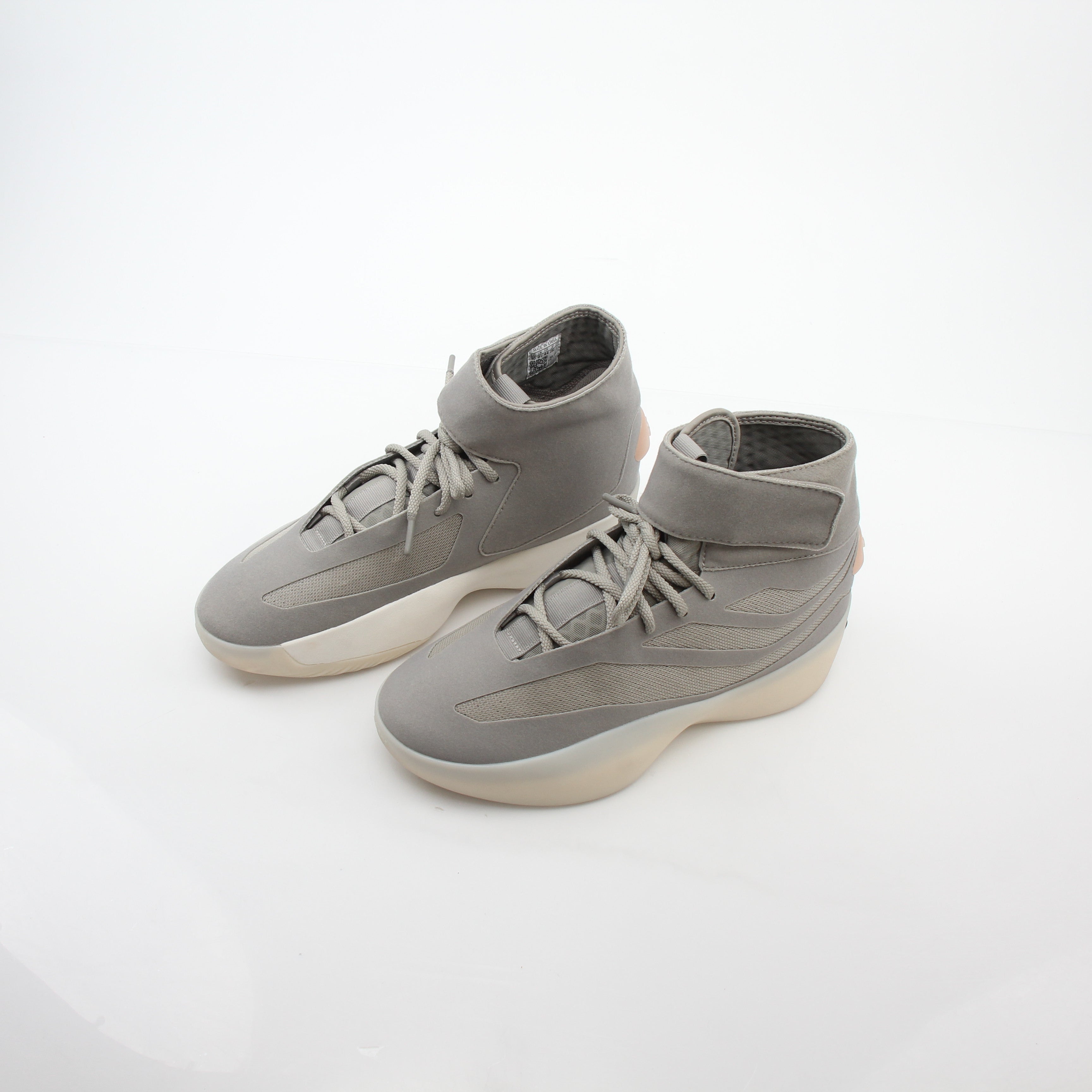 Adidas x Fear of God Putty Beige Athletics II basketball sneakers with high-top design and gold accents.