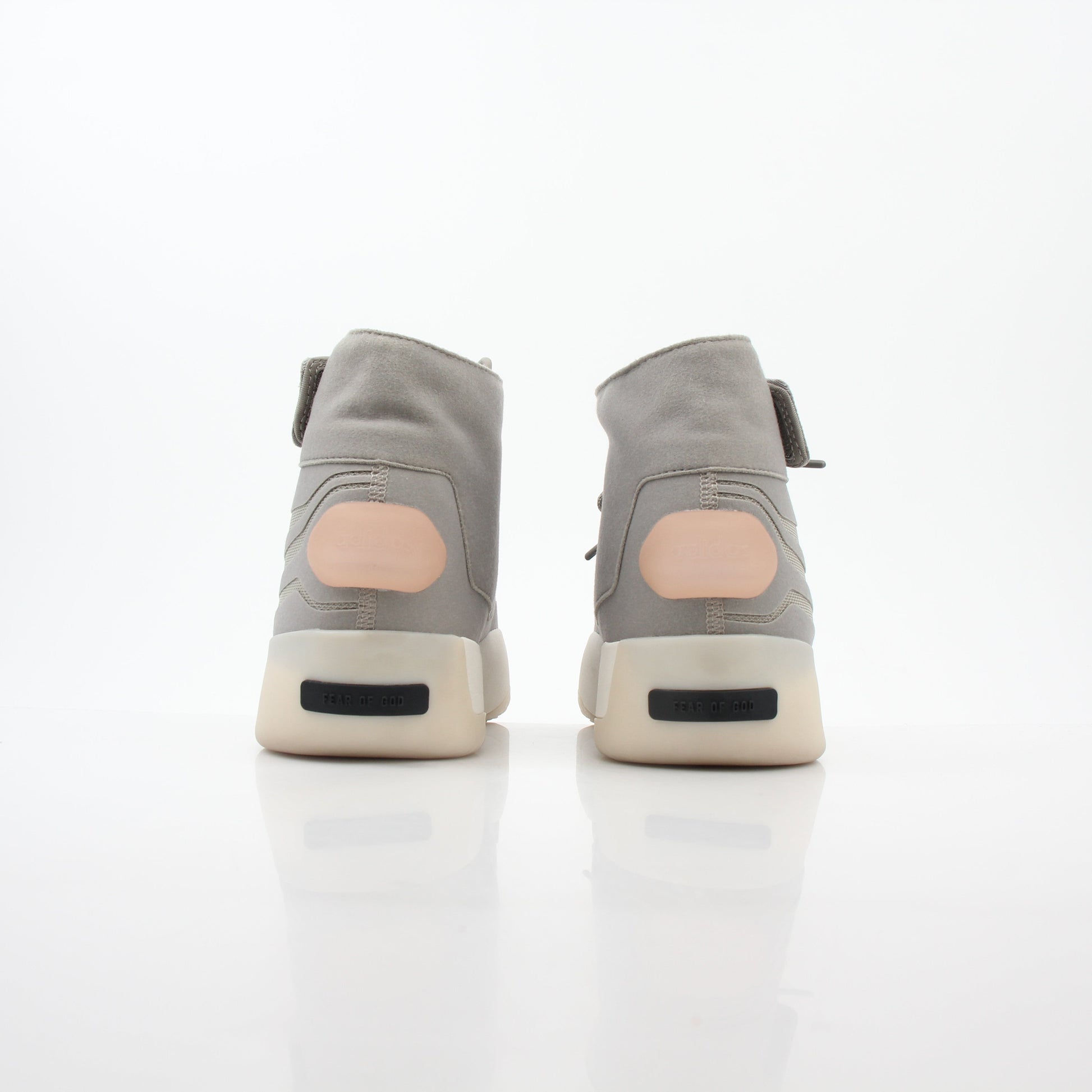 Beige Adidas x Fear of God Putty Athletics II basketball sneakers with high-top design and gold accents, displayed on a white background.