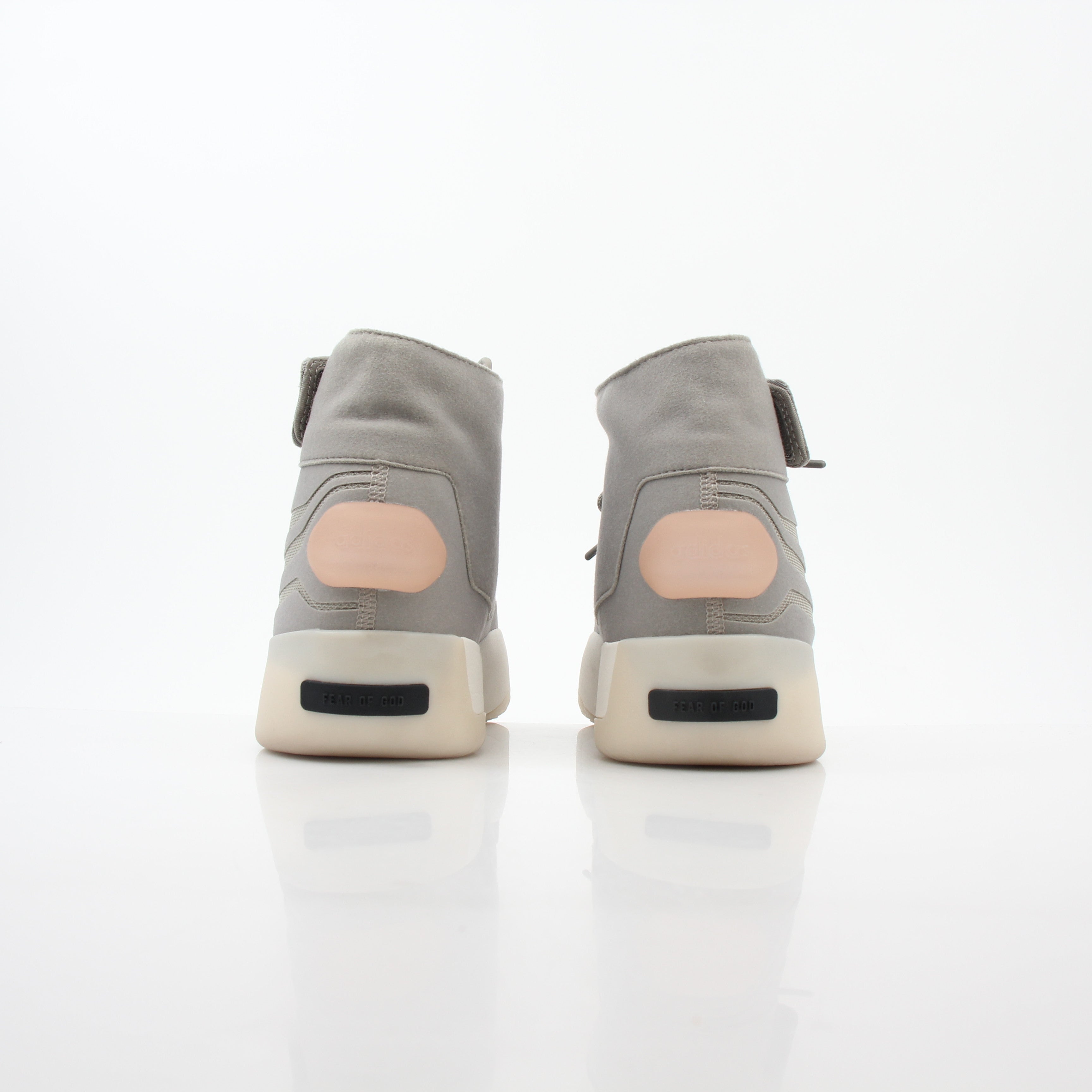 Beige Adidas x Fear of God Putty Athletics II basketball sneakers with high-top design and gold accents, displayed on a white background.