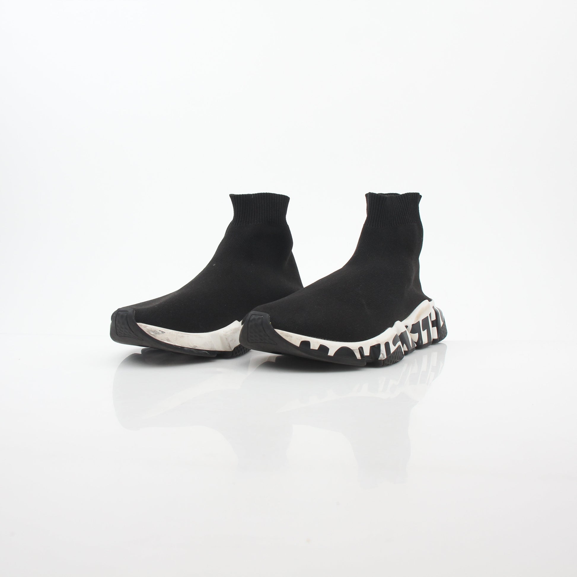 Black Balenciaga Speed Graffiti Sock Sneakers with graffiti-style design and sleek athletic silhouette, displayed on a white background.