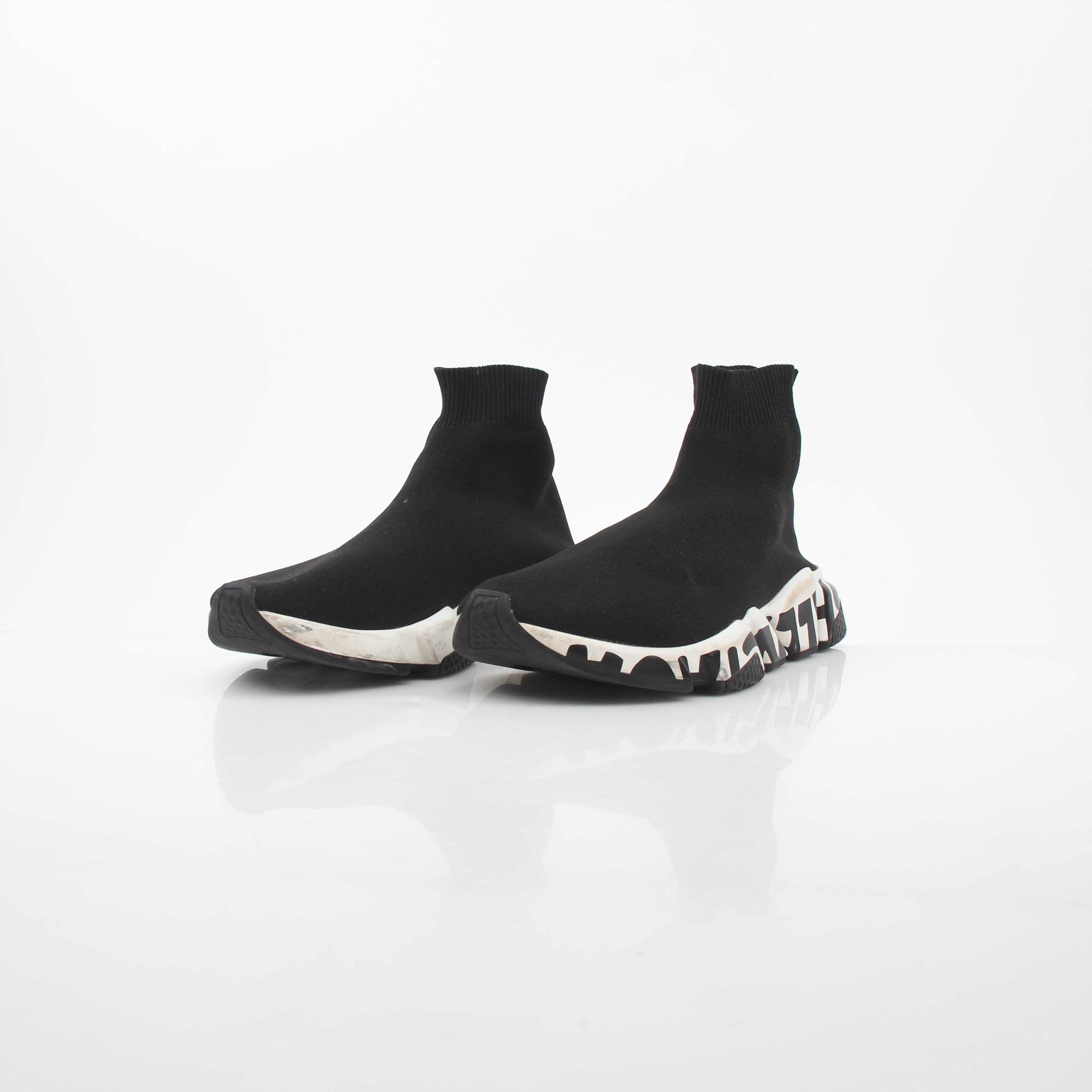 Black Balenciaga Speed Graffiti Sock Sneakers with graffiti-style design and sleek athletic silhouette, displayed on a white background.