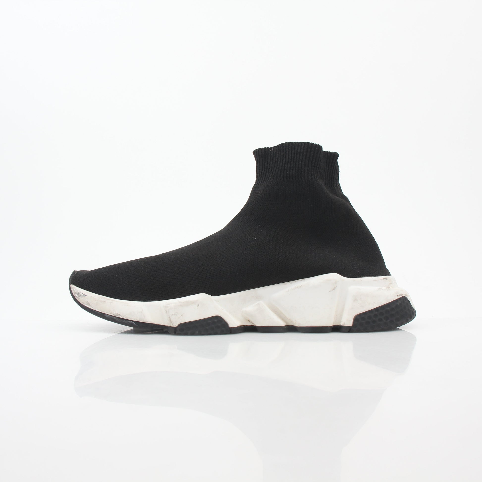 Black Balenciaga Speed Graffiti Sock Sneakers with bold graffiti design and sleek athletic style, worn on a model's feet.