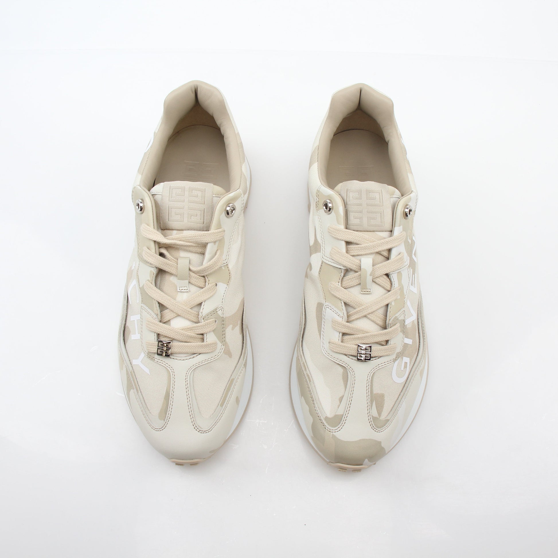 Givenchy beige GIV Runner logo camo sneakers, Gold & Beyond shoes with camouflage pattern and logo details, front view.