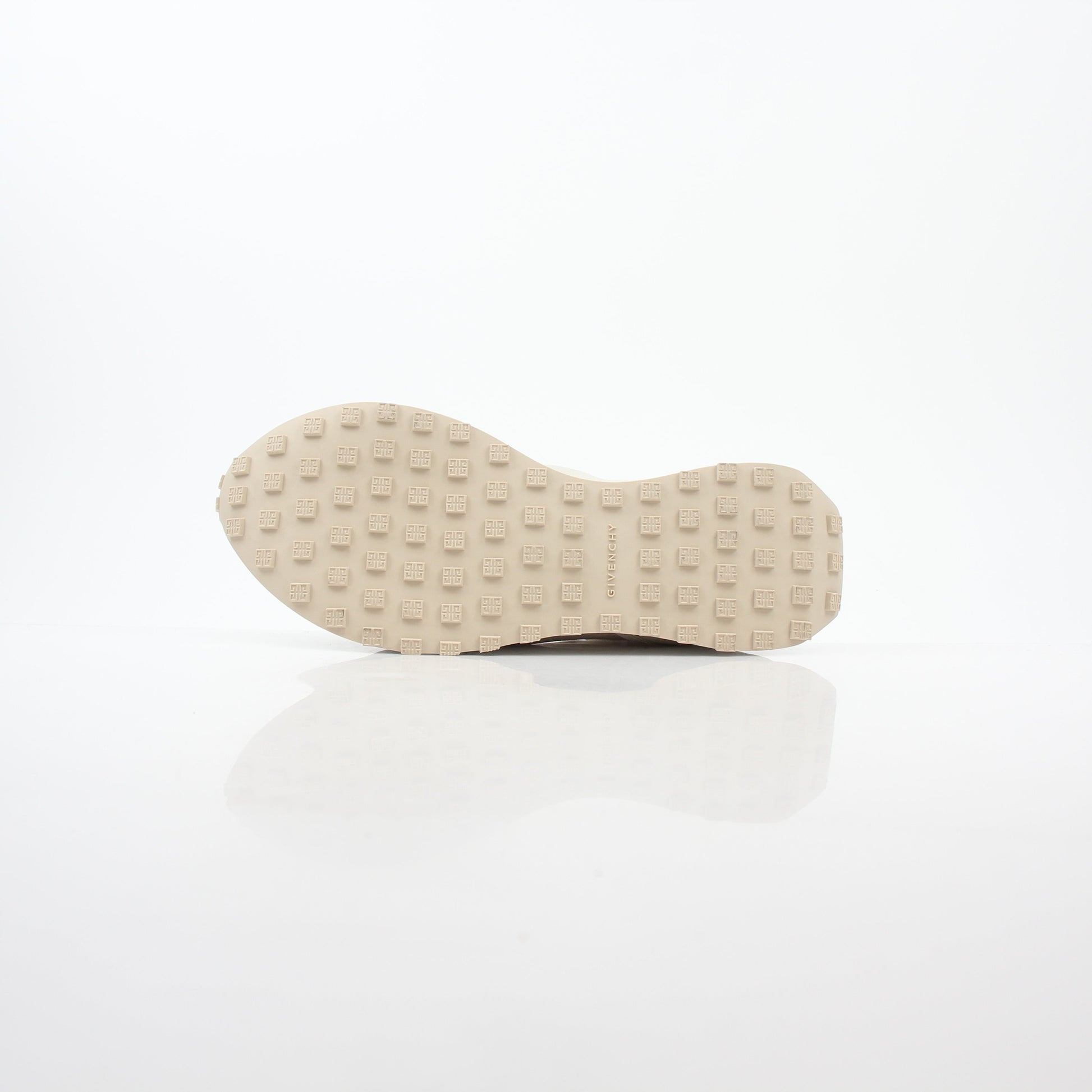 Givenchy beige GIV Runner logo camo sneakers from Gold & Beyond, showcasing the sneakers' beige color and camo pattern.