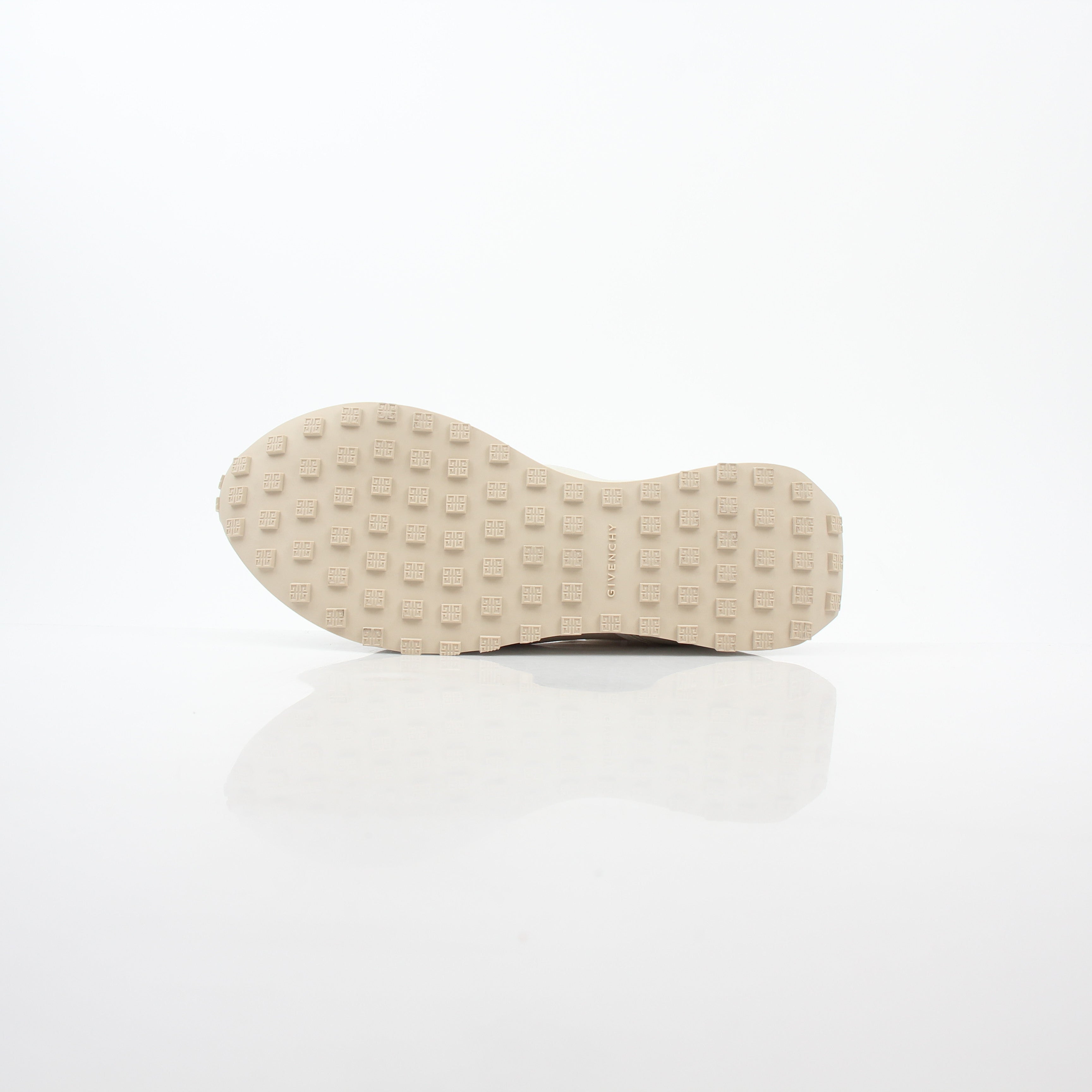Givenchy beige GIV Runner logo camo sneakers from Gold & Beyond, showcasing the sneakers' beige color and camo pattern.
