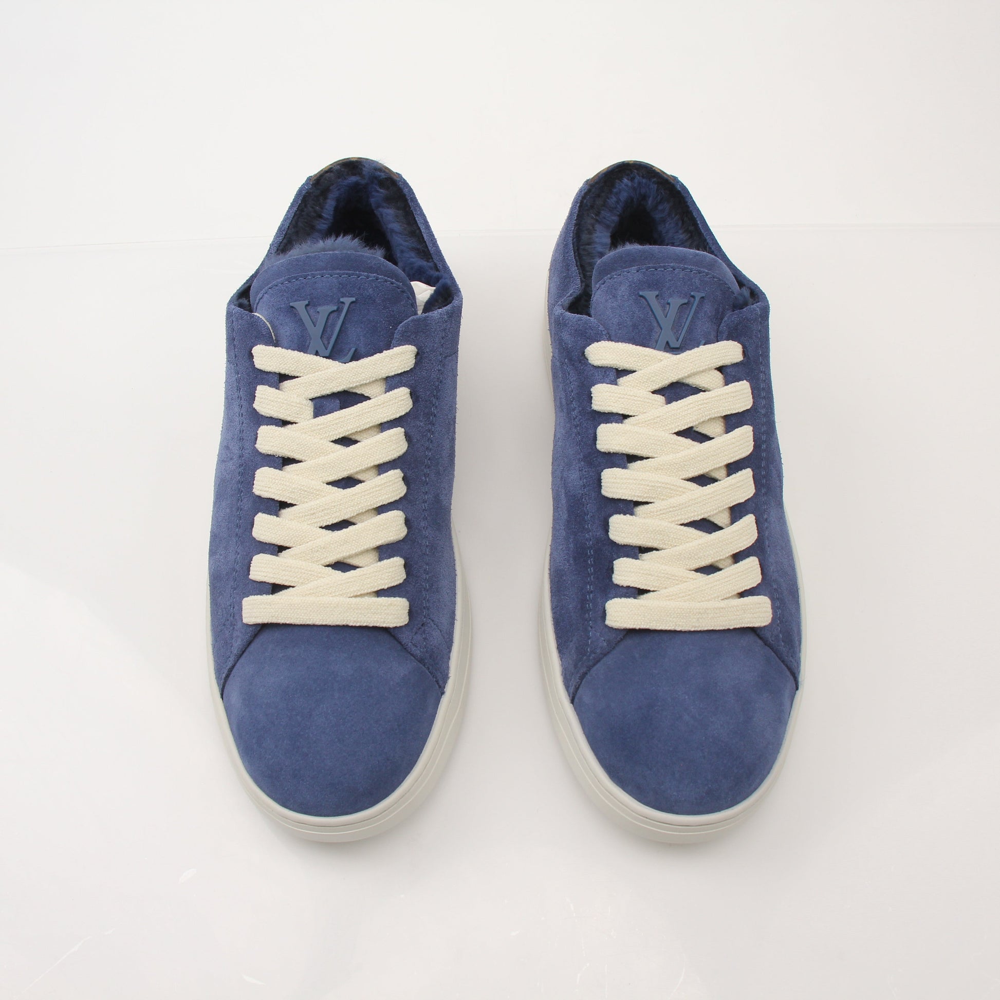 Louis Vuitton Men’s LV Resort Sneakers in black with white soles, featuring stylish design and brand logo on the side.