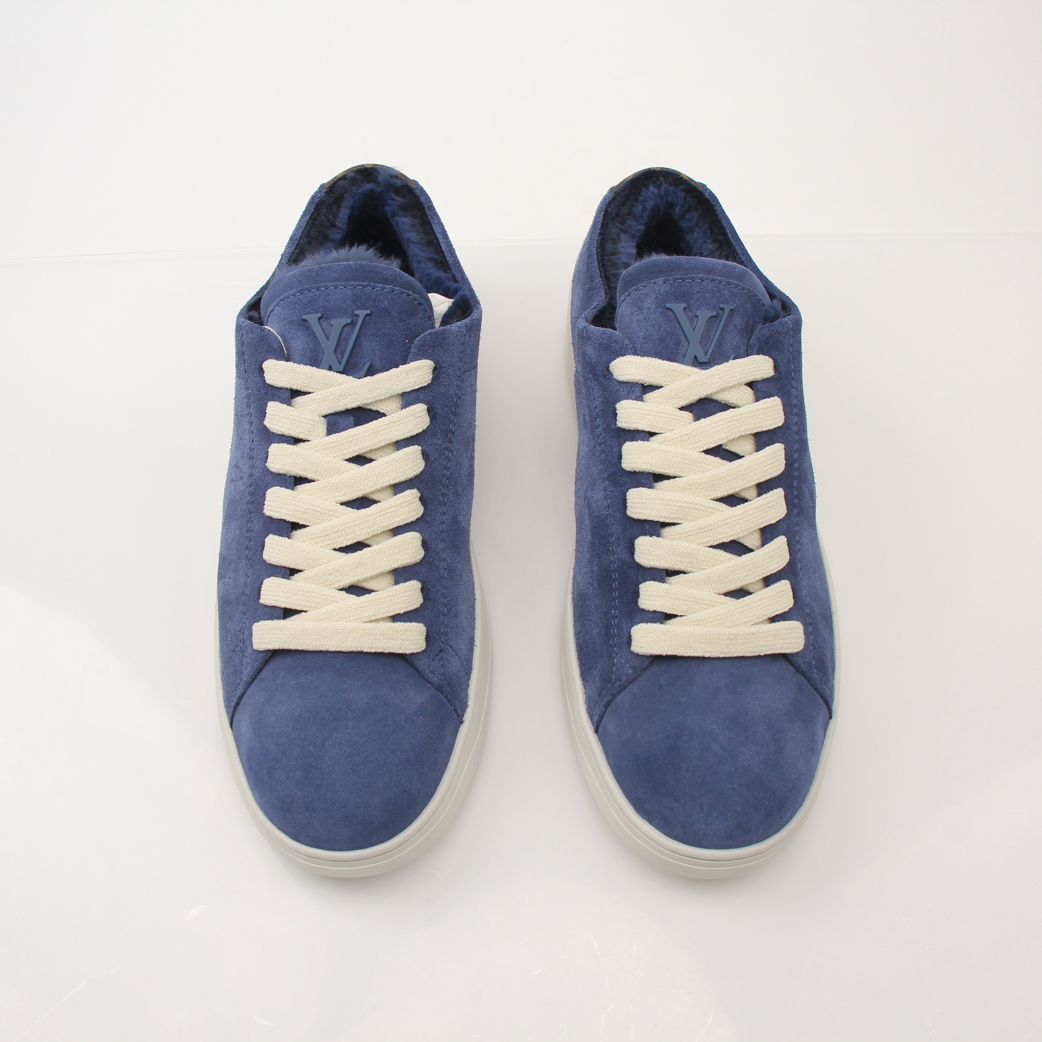 Louis Vuitton Men’s LV Resort Sneakers in black with white soles, featuring stylish design and brand logo on the side.