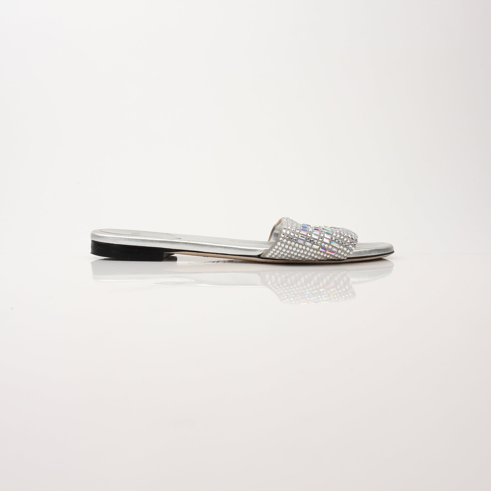 Gold & Beyond Fendi women’s crystal-embellished signature slide shoes with elegant design and sparkling details.