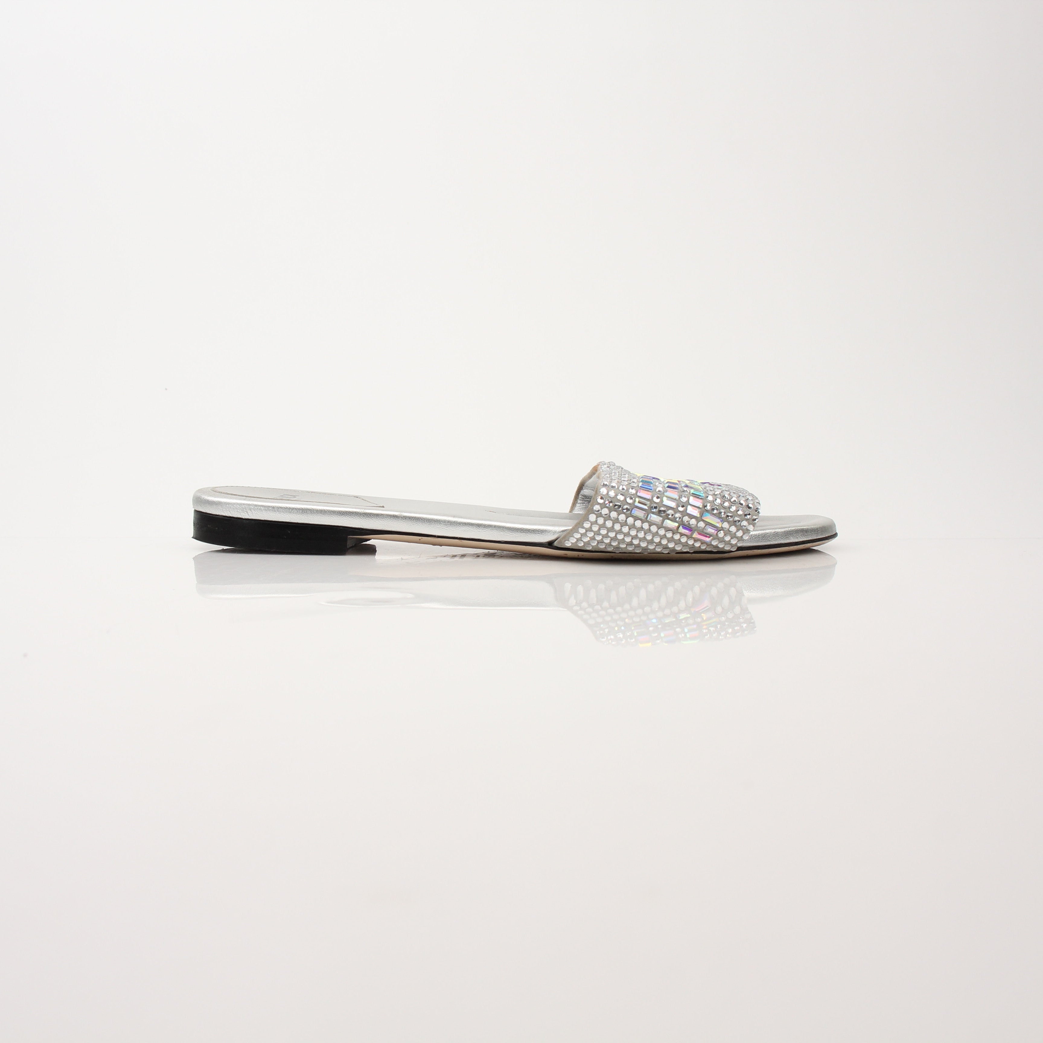 Gold & Beyond Fendi women’s crystal-embellished signature slide shoes with elegant design and sparkling details.