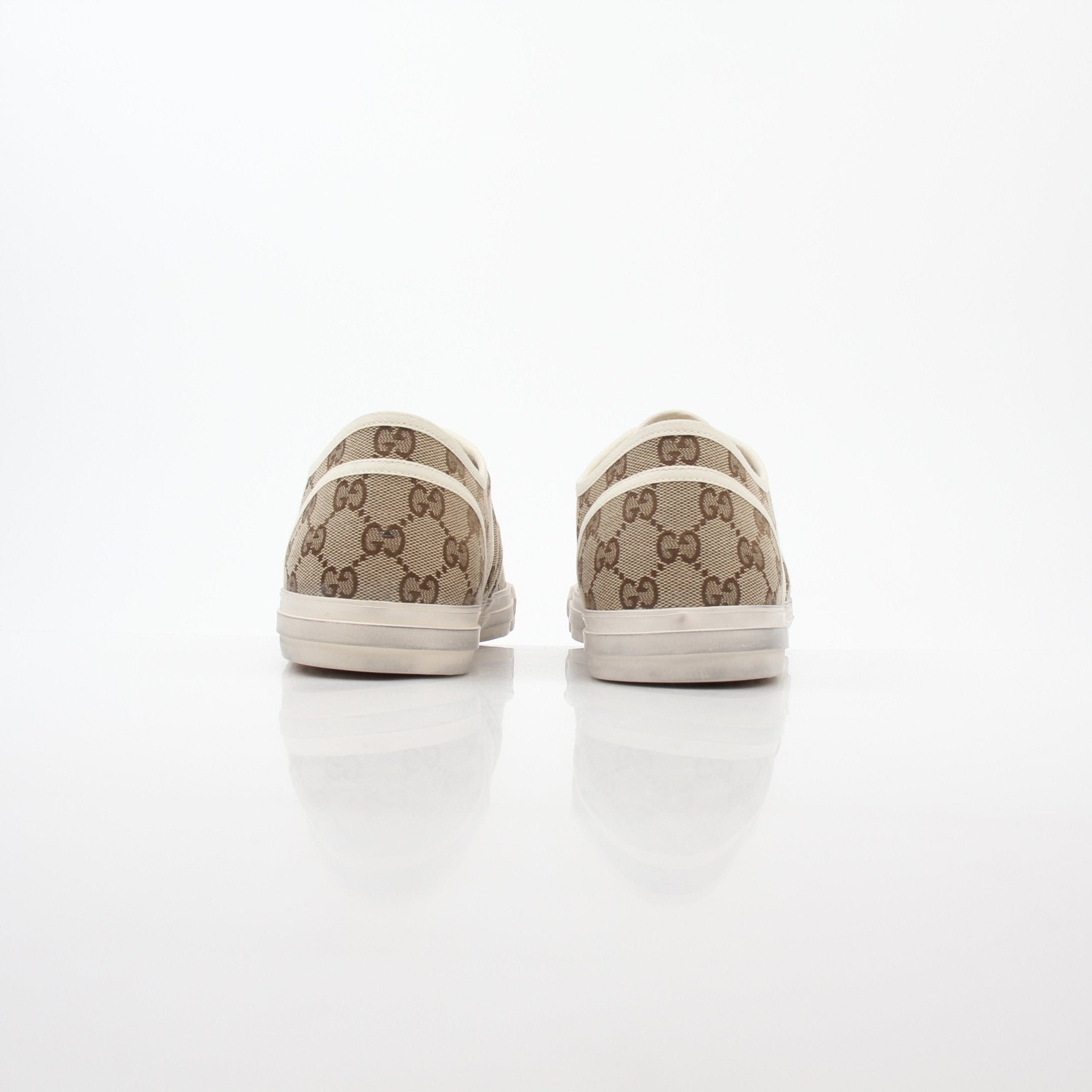 Gold & Beyond Gucci GG Supreme sneakers featuring classic logo pattern, white soles, and stylish design for casual wear.