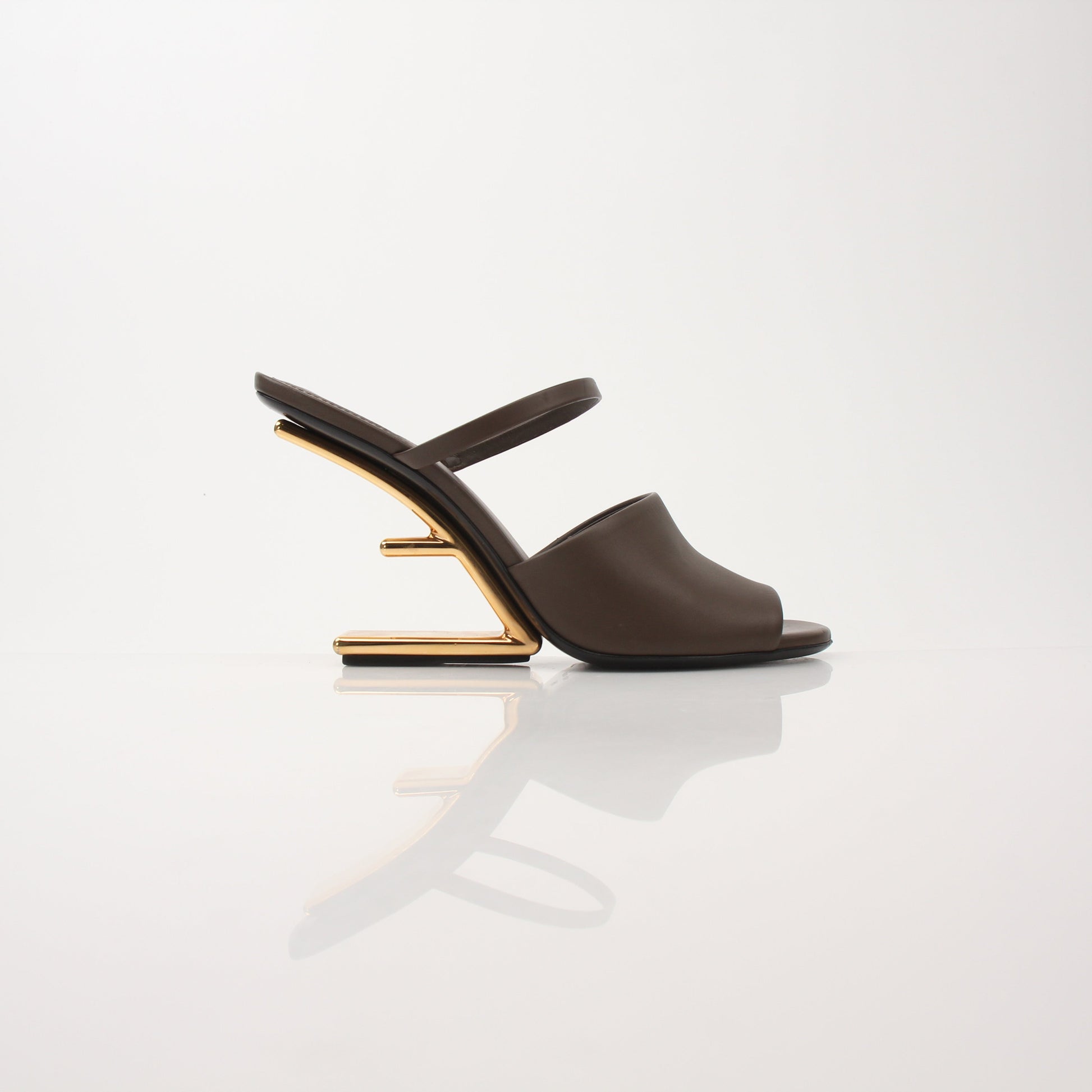 Fendi First Sculpted Heel Sandals by Gold & Beyond, featuring elegant heels and sculpted design on a neutral background.