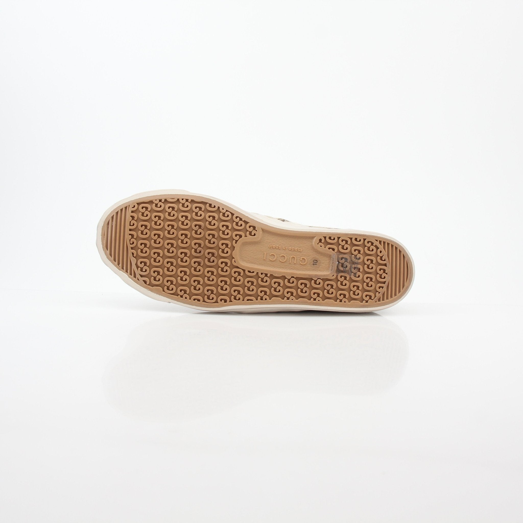 Gold & Beyond Gucci GG Supreme sneakers with beige and brown canvas, white rubber soles, and signature logo detailing.