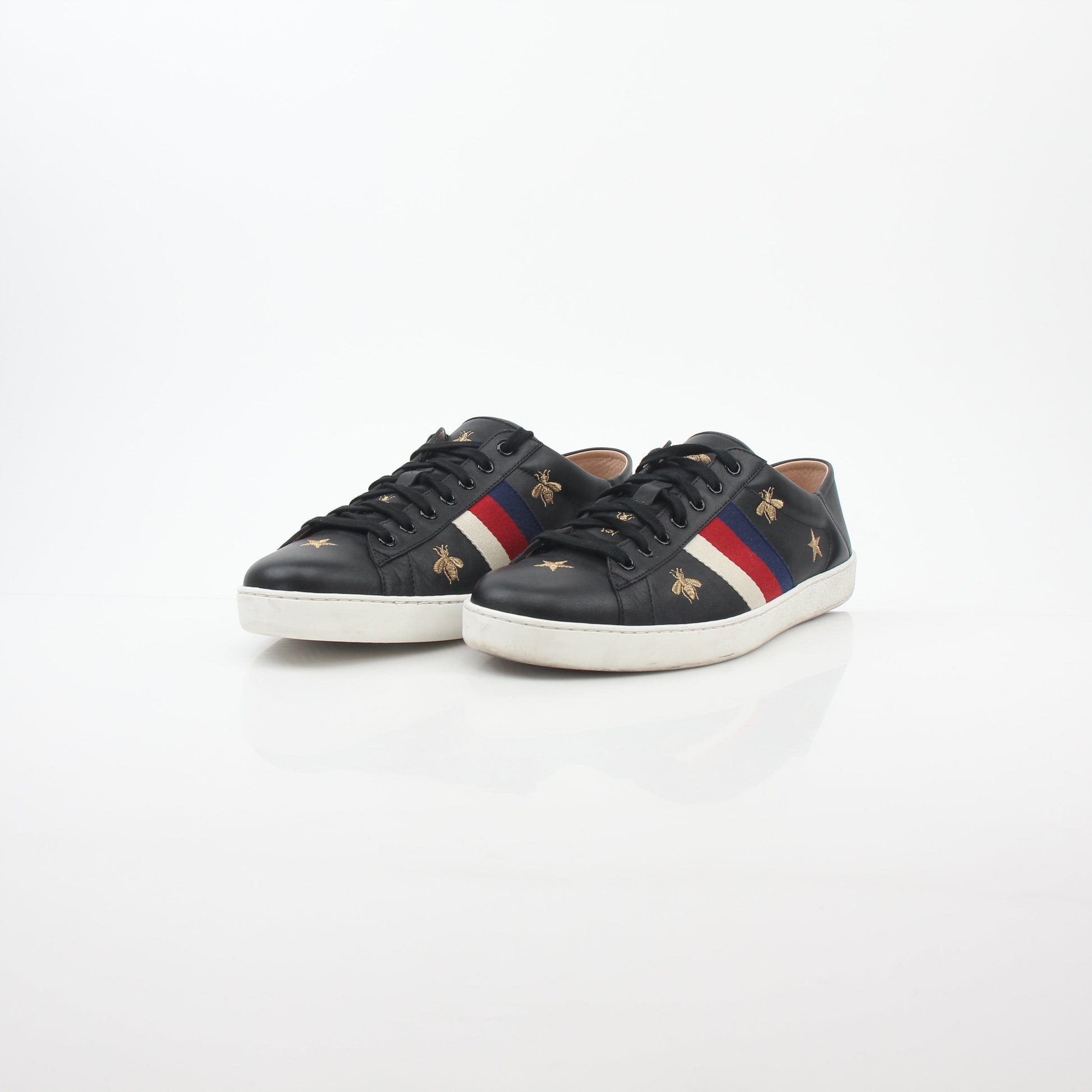 Gucci black embroidered Ace Web low-top sneakers with signature branding and detailed embroidery on the side, casual footwear.