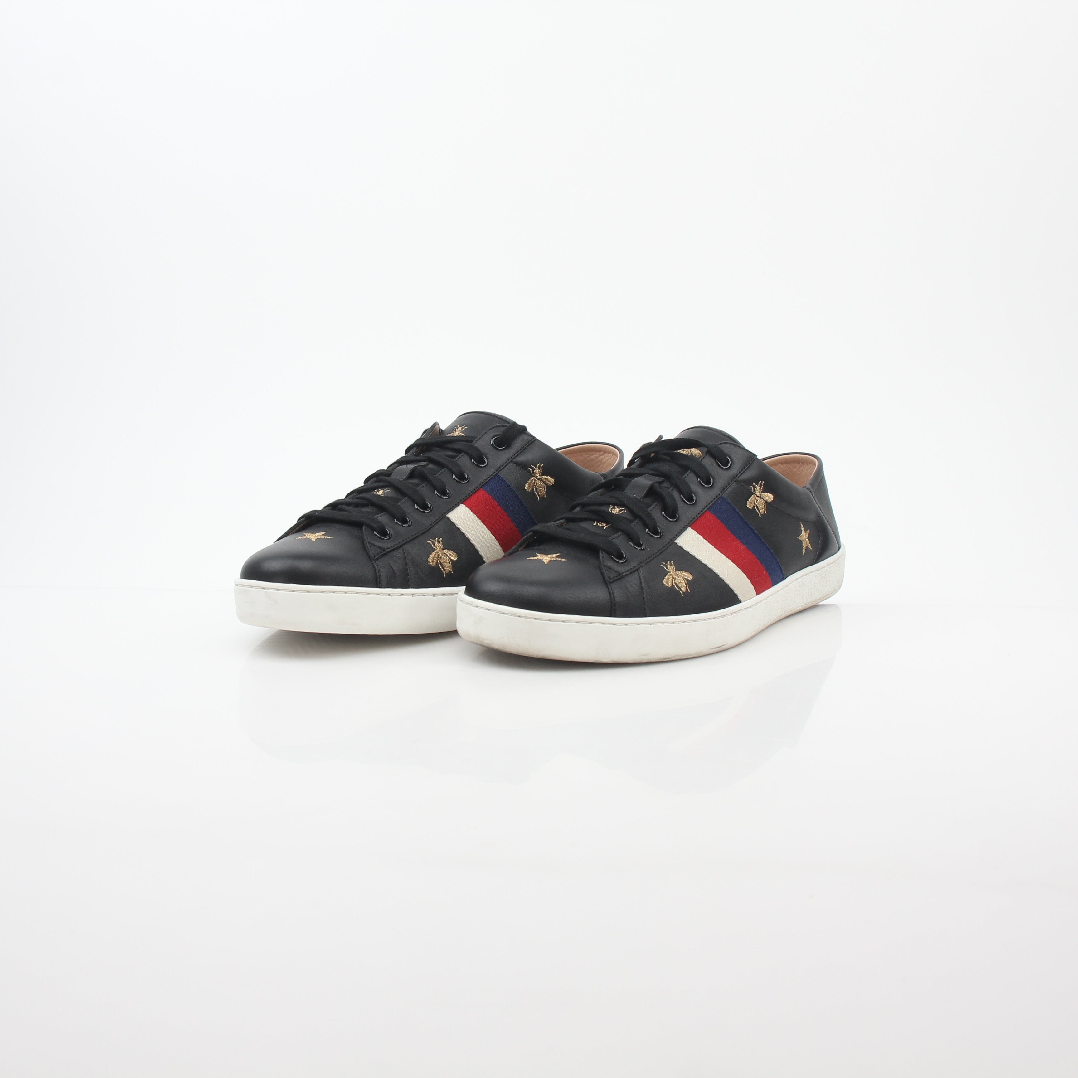Gucci black embroidered Ace Web low-top sneakers with signature branding and detailed embroidery on the side, casual footwear.