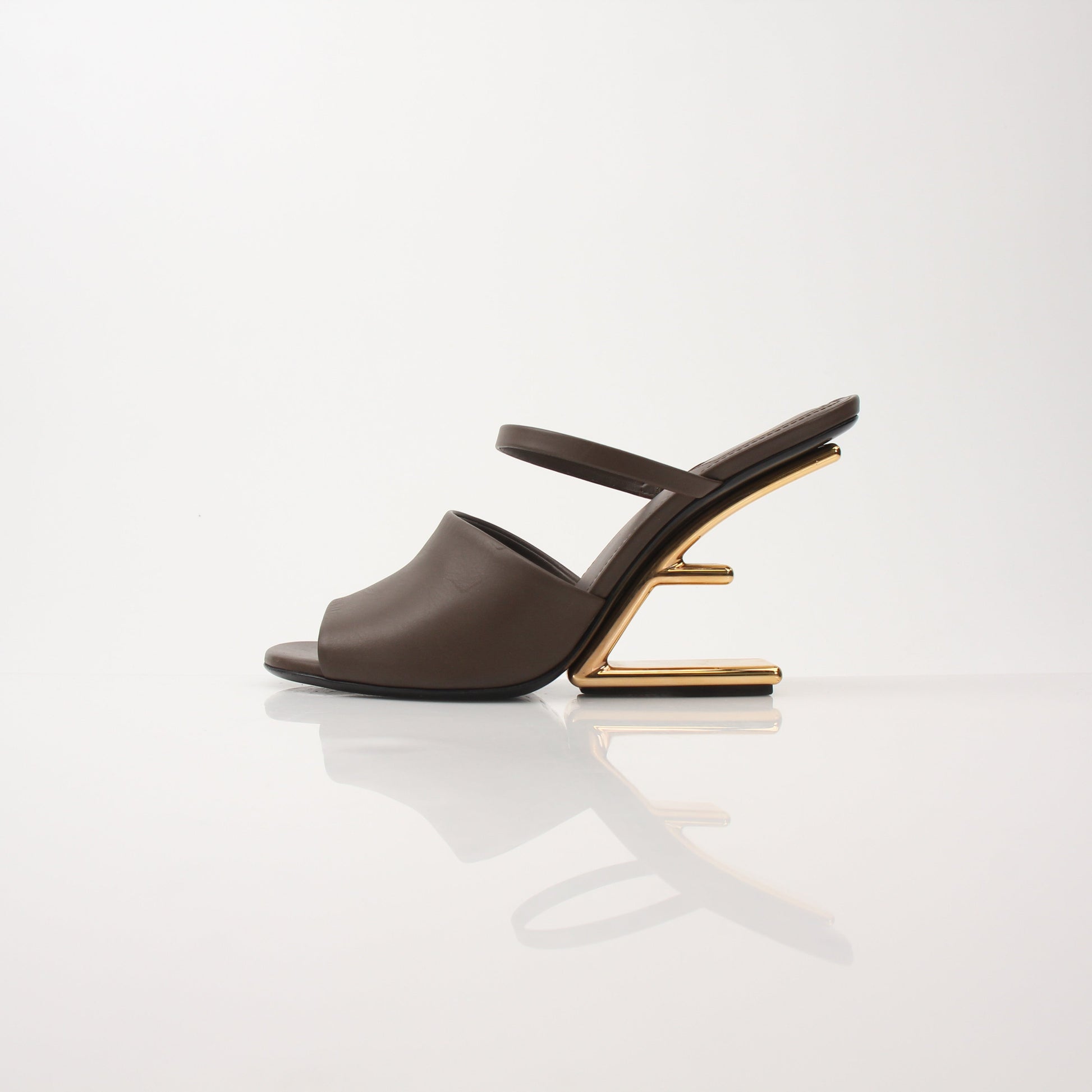 Fendi First Sculpted Heel Sandals with elegant design, featuring sculpted heels and stylish straps on a neutral background.