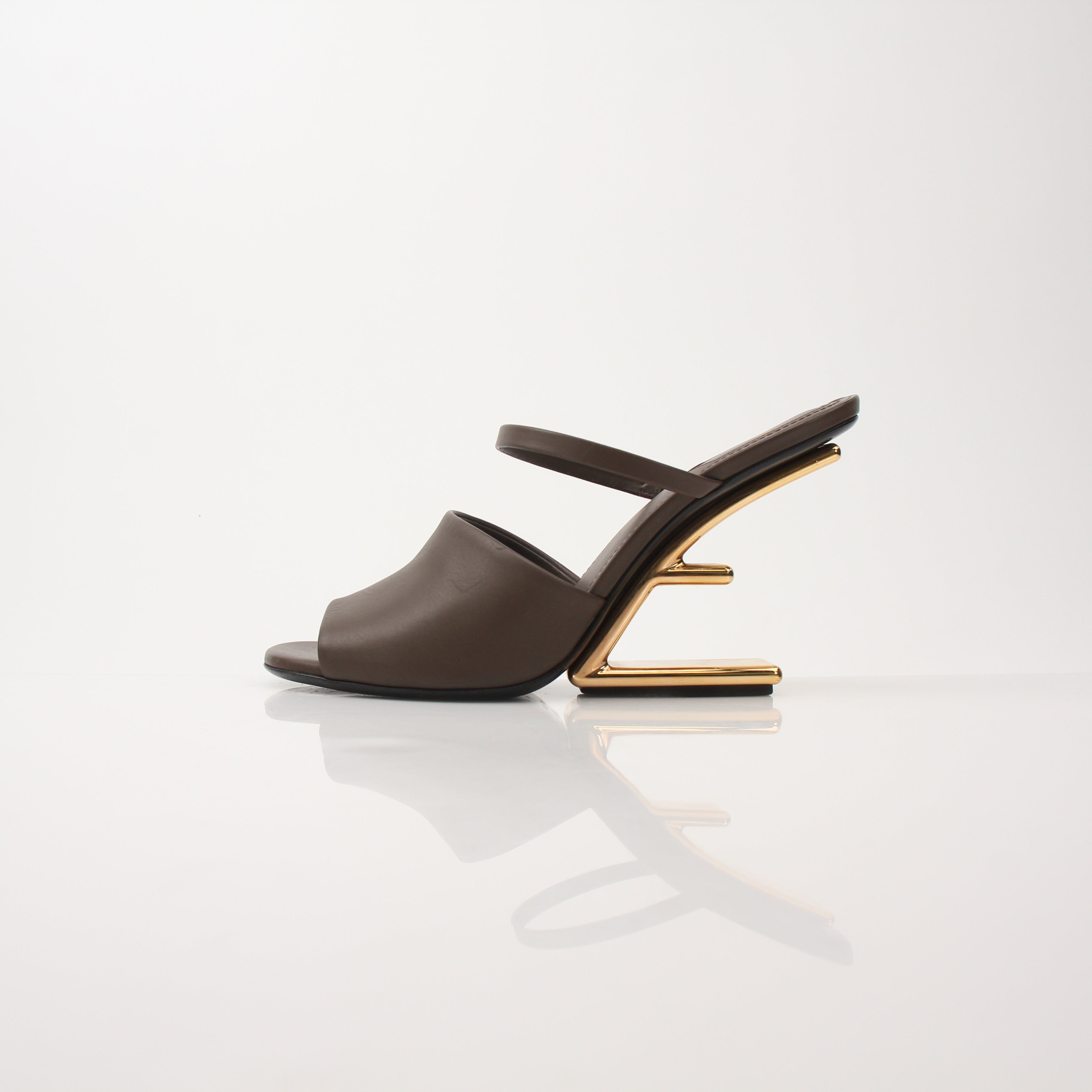Fendi First Sculpted Heel Sandals with elegant design, featuring sculpted heels and stylish straps on a neutral background.