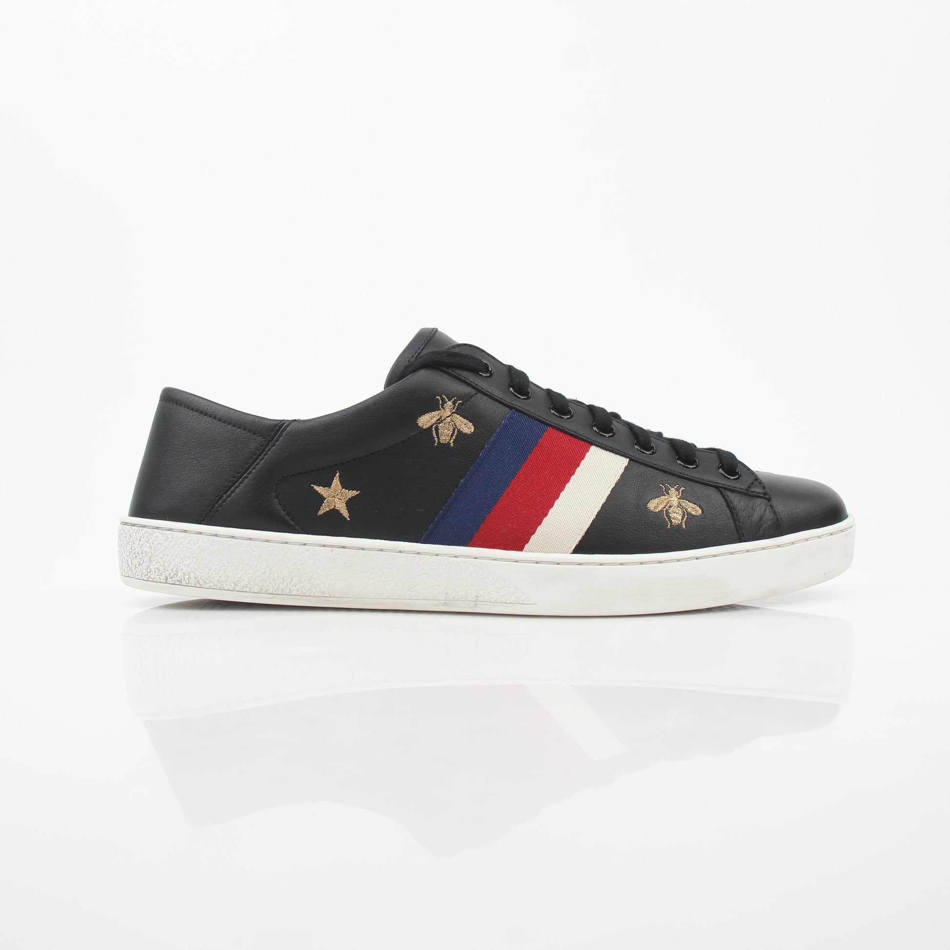 Gucci black embroidered Ace Web low-top sneakers, stylish shoes with signature design, displayed on clean background.