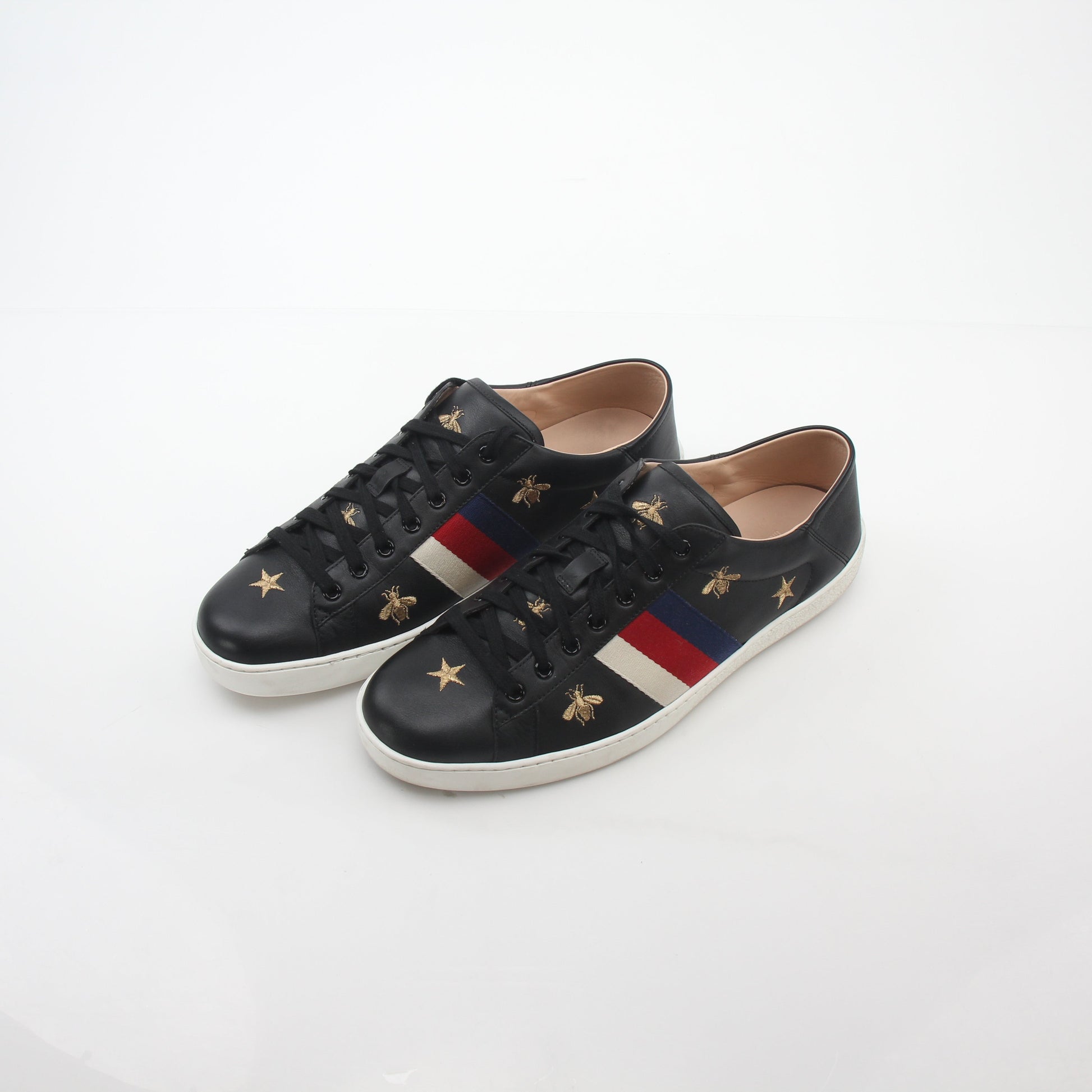 Gucci black embroidered Ace Web low-top sneakers with logo details and stylish design, crafted for casual wear.