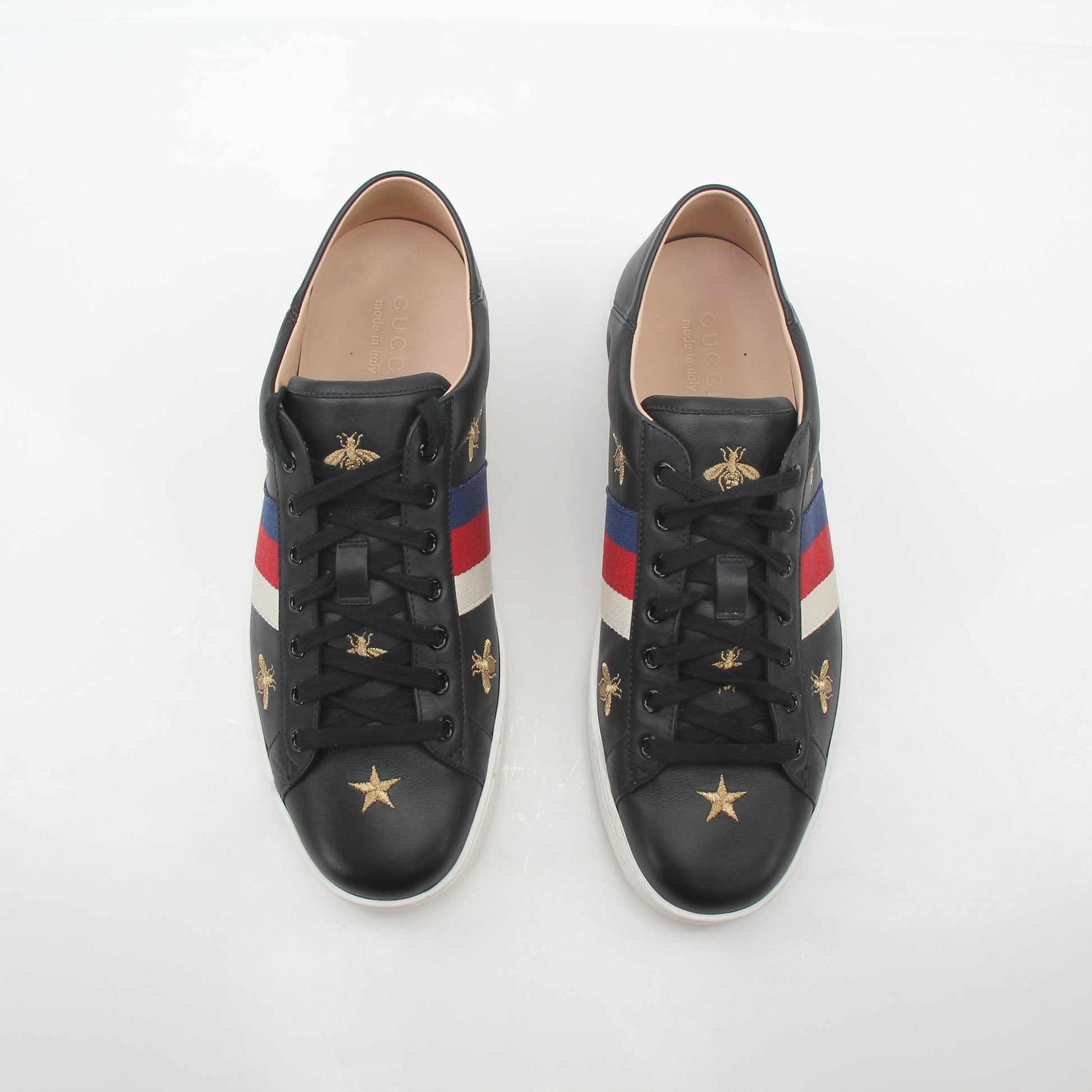 Gucci black embroidered Ace Web low-top sneakers with stylish design, showcasing the iconic logo and detailed embroidery.