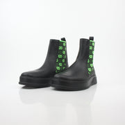 Gucci black and neon green GG Dali ankle boots, stylish shoes with bold color accents and designer branding.