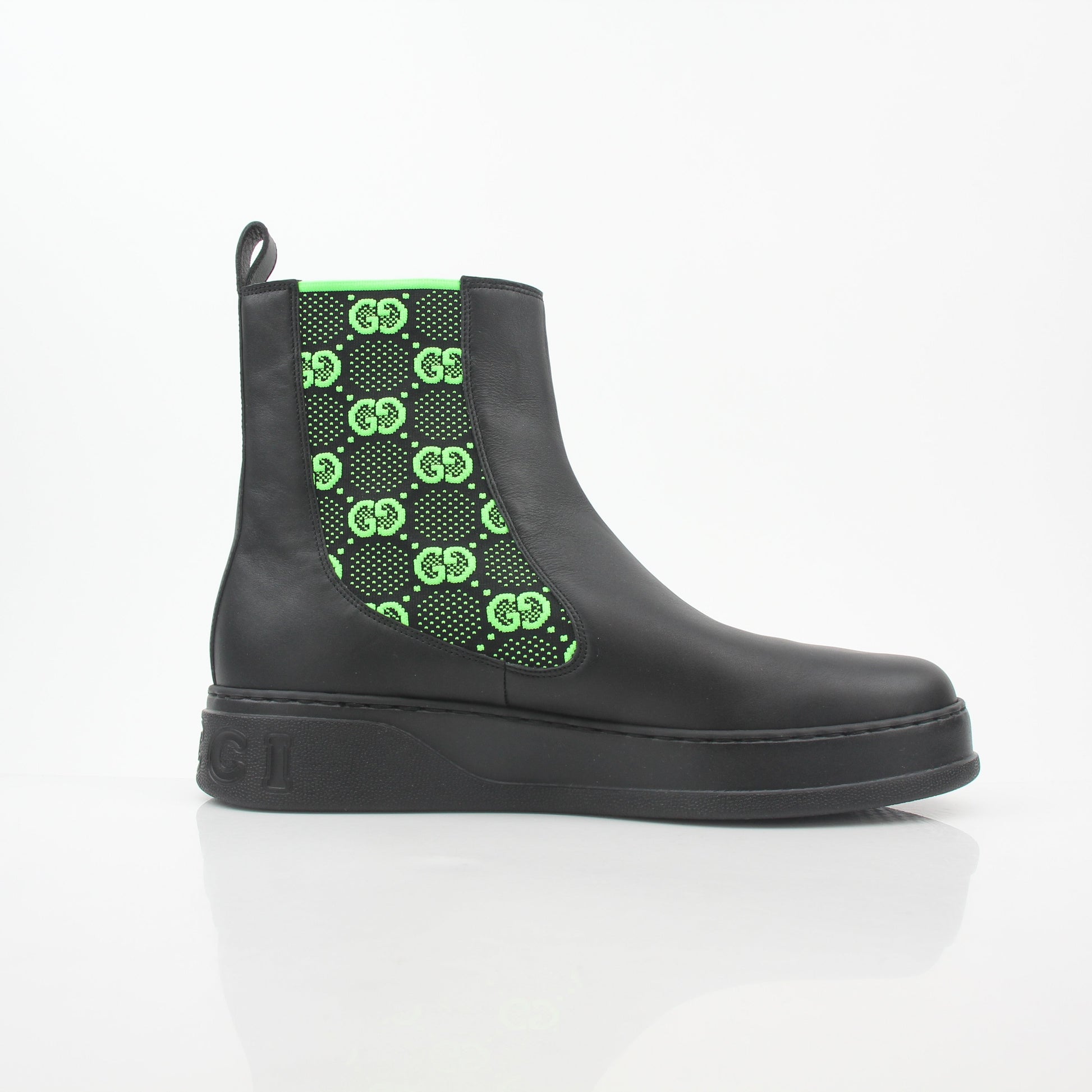 Gucci black and neon green GG Dali ankle boots, stylish shoes with bold color accents, displayed on a clean background.
