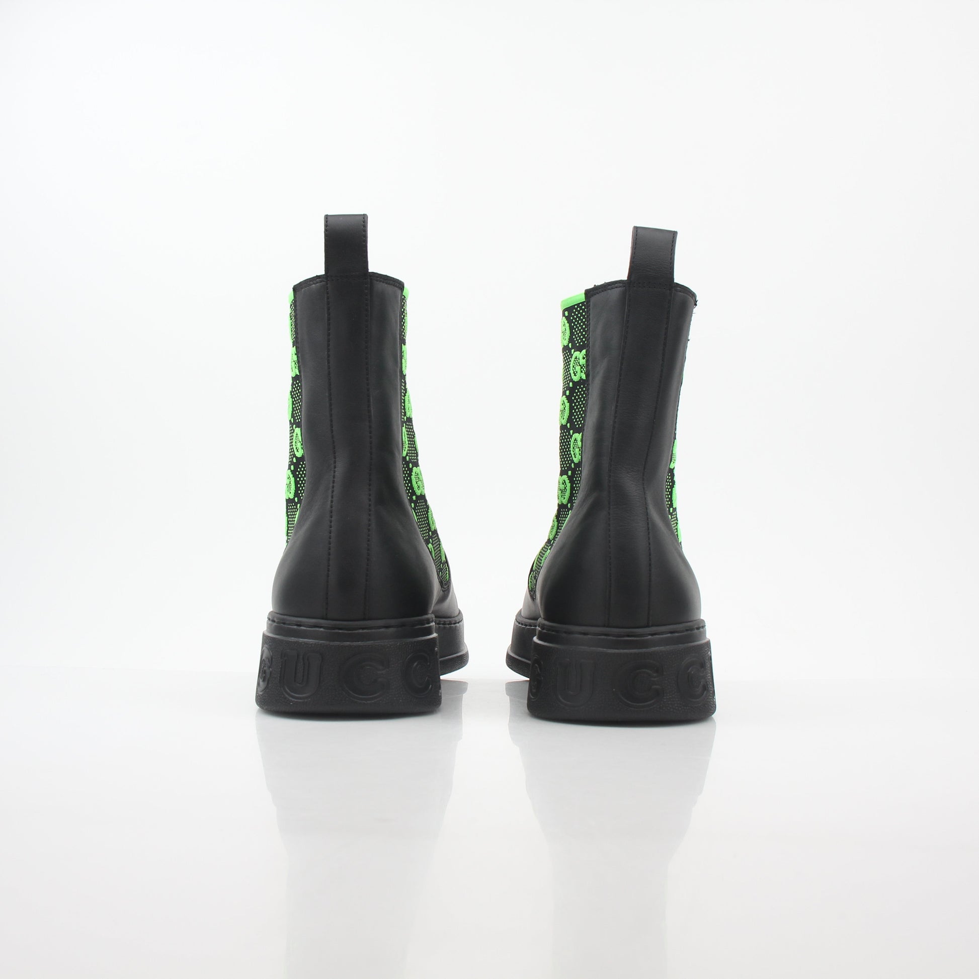 Gucci black and neon green GG Dali ankle boots with sleek design and stylish branding, perfect for fashion-forward footwear.