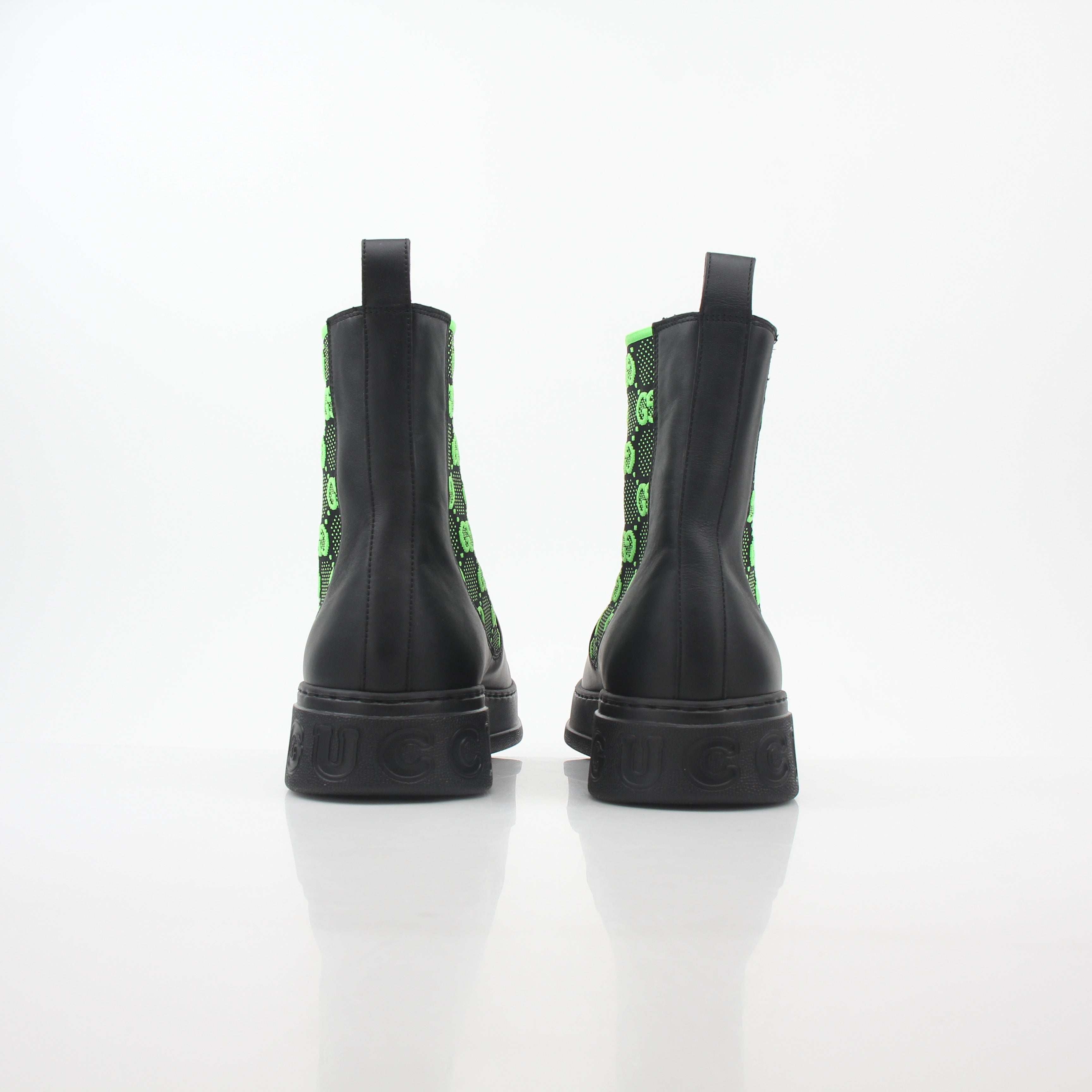 Gucci black and neon green GG Dali ankle boots with sleek design and stylish branding, perfect for fashion-forward footwear.