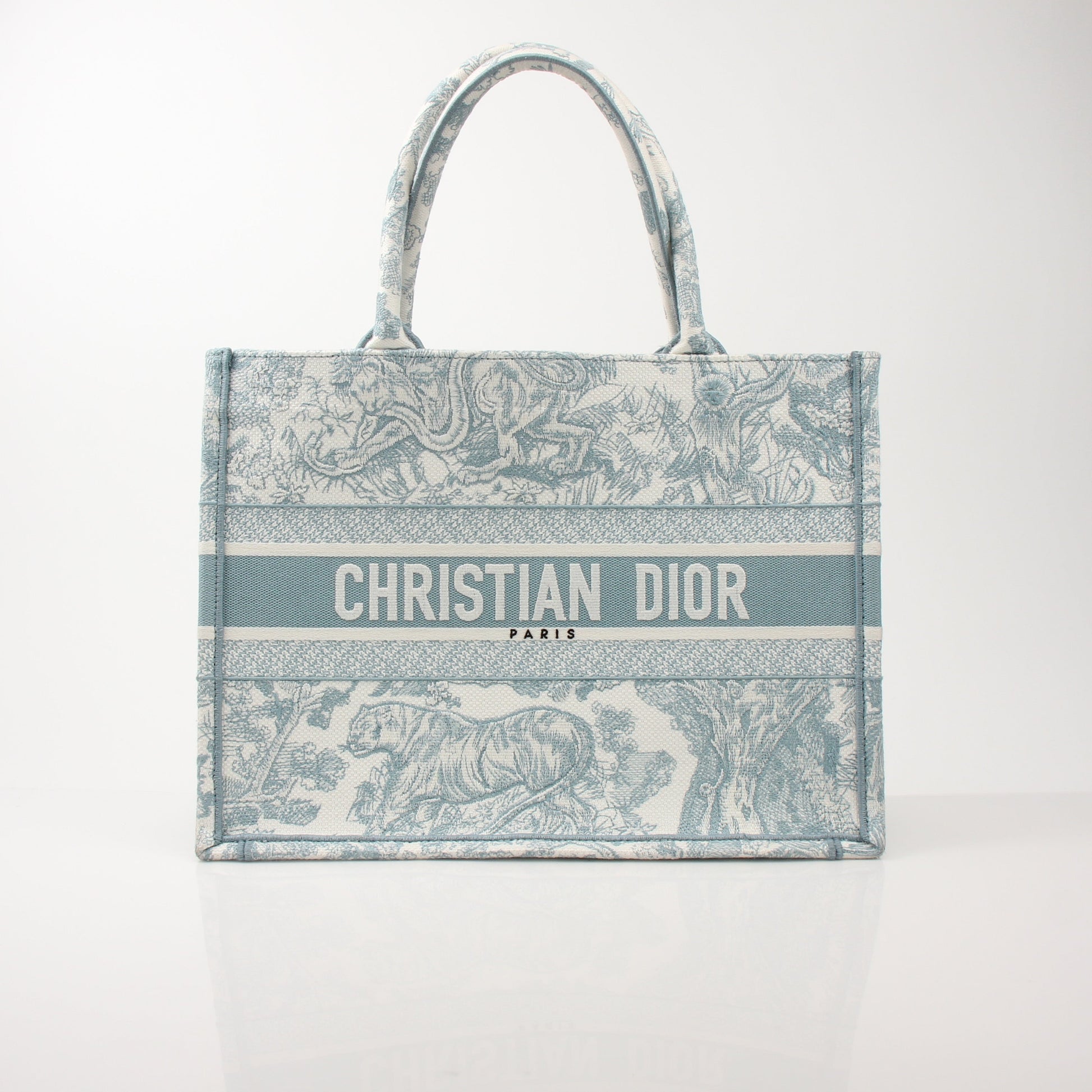 Christian Dior Toile de Jouy Book Tote handbag with floral pattern, featuring structured design and top handles.