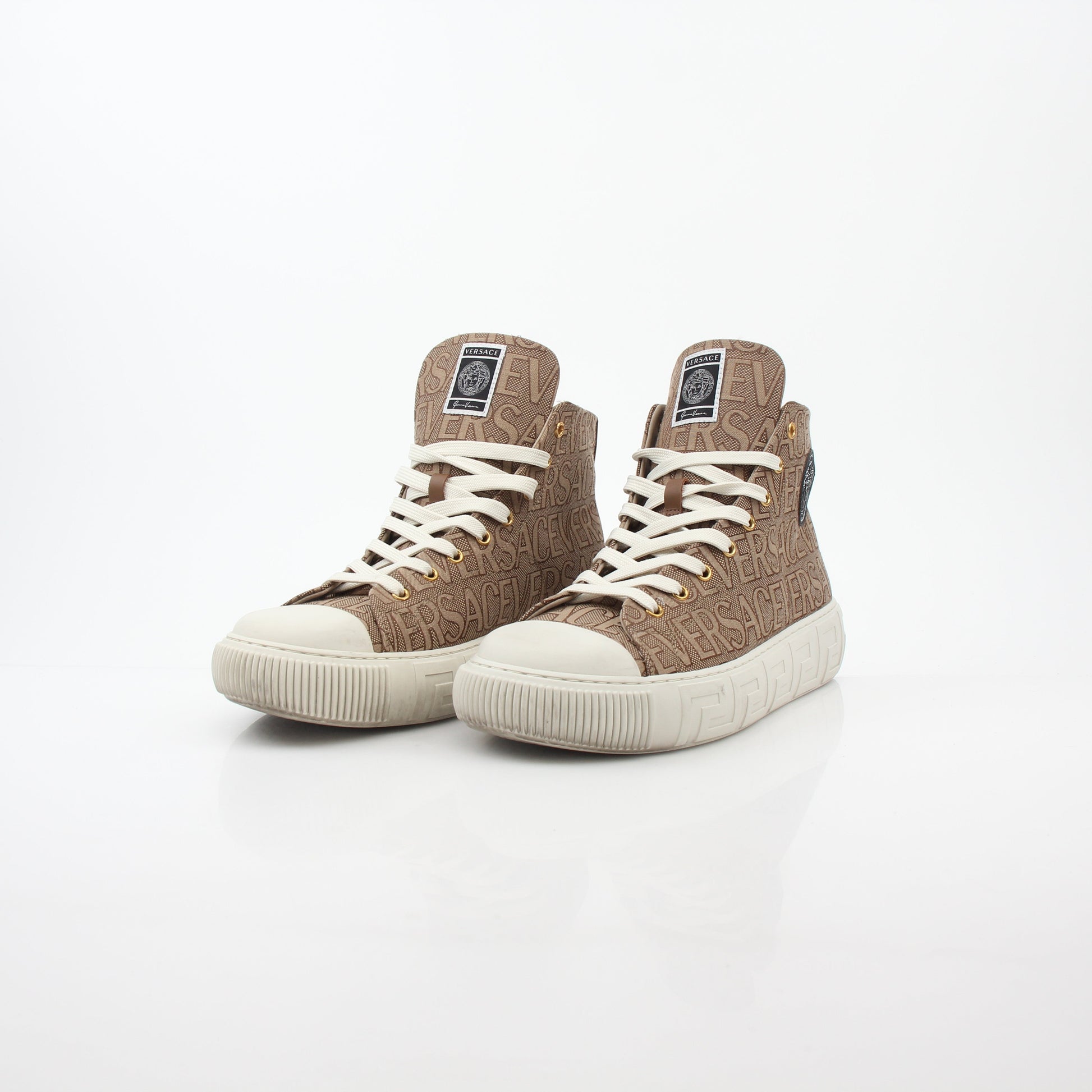 Gold & Beyond Versace brown logo jacquard Greca high-top sneakers with signature pattern and high-top design, close-up view.