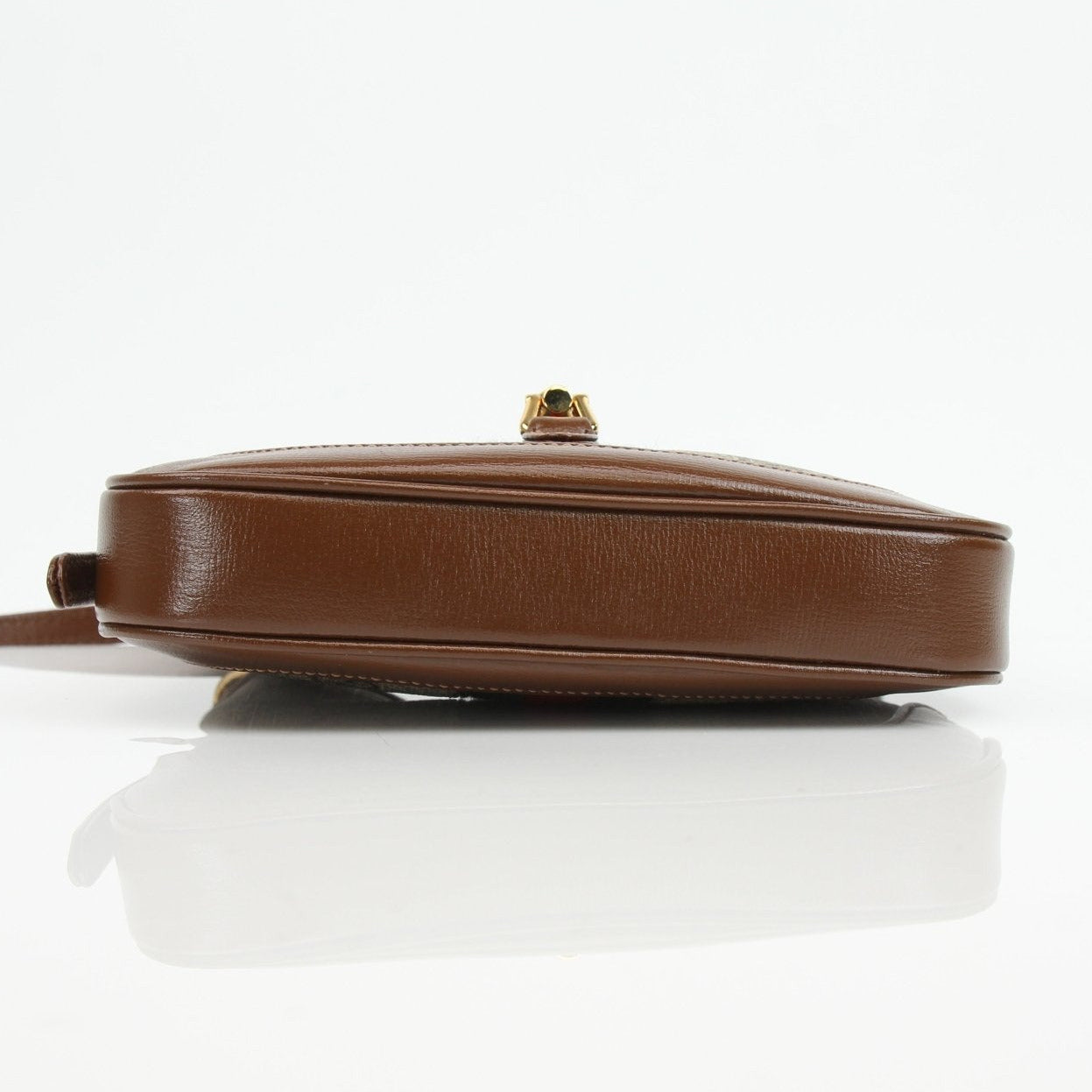 Gucci Jackie 1961 Mini handbag with beige leather and signature green-red-green stripe detail, classic and stylish accessory.