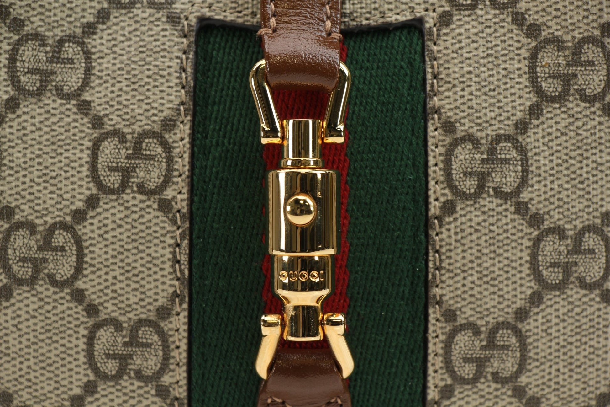 Gucci Jackie 1961 Mini Handbag in beige leather with gold-tone hardware and top handle, stylish and compact accessory.