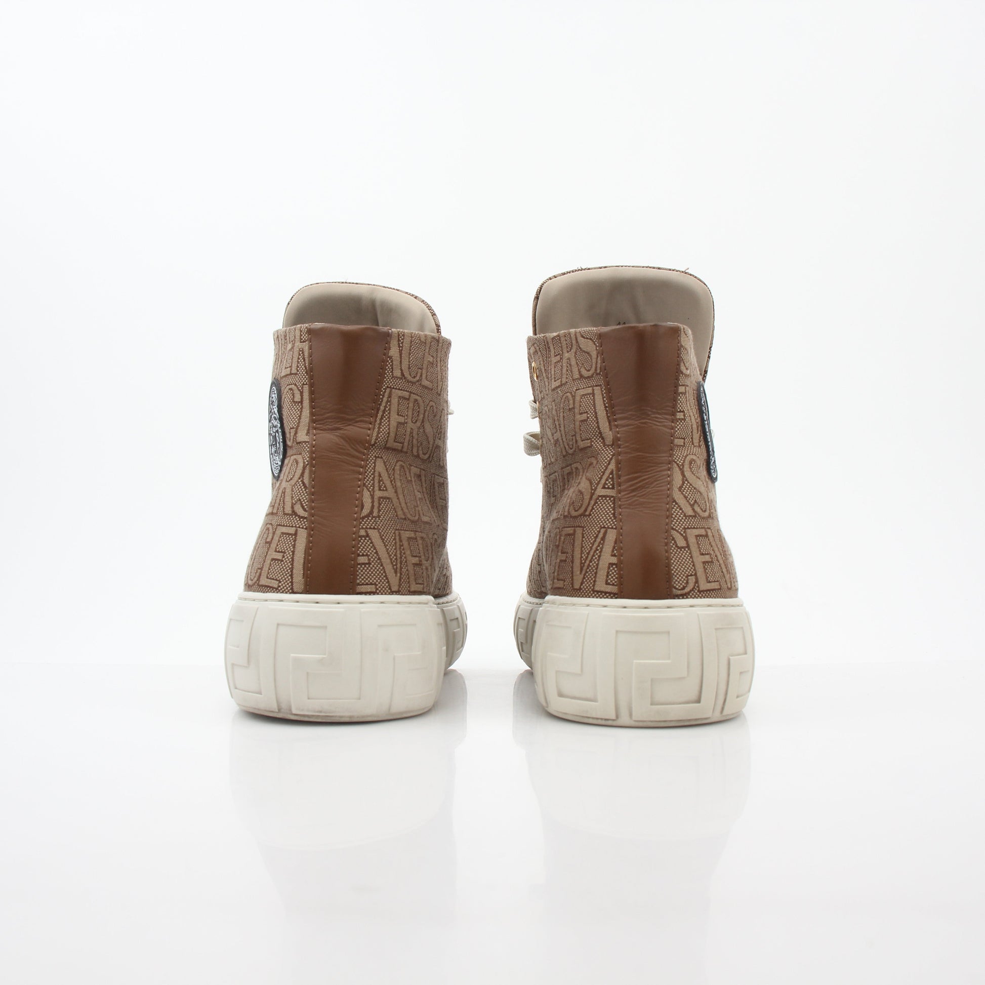 Gold & Beyond Versace brown logo jacquard Greca high-top sneakers with stylish design and iconic branding, shown in close-up shot.