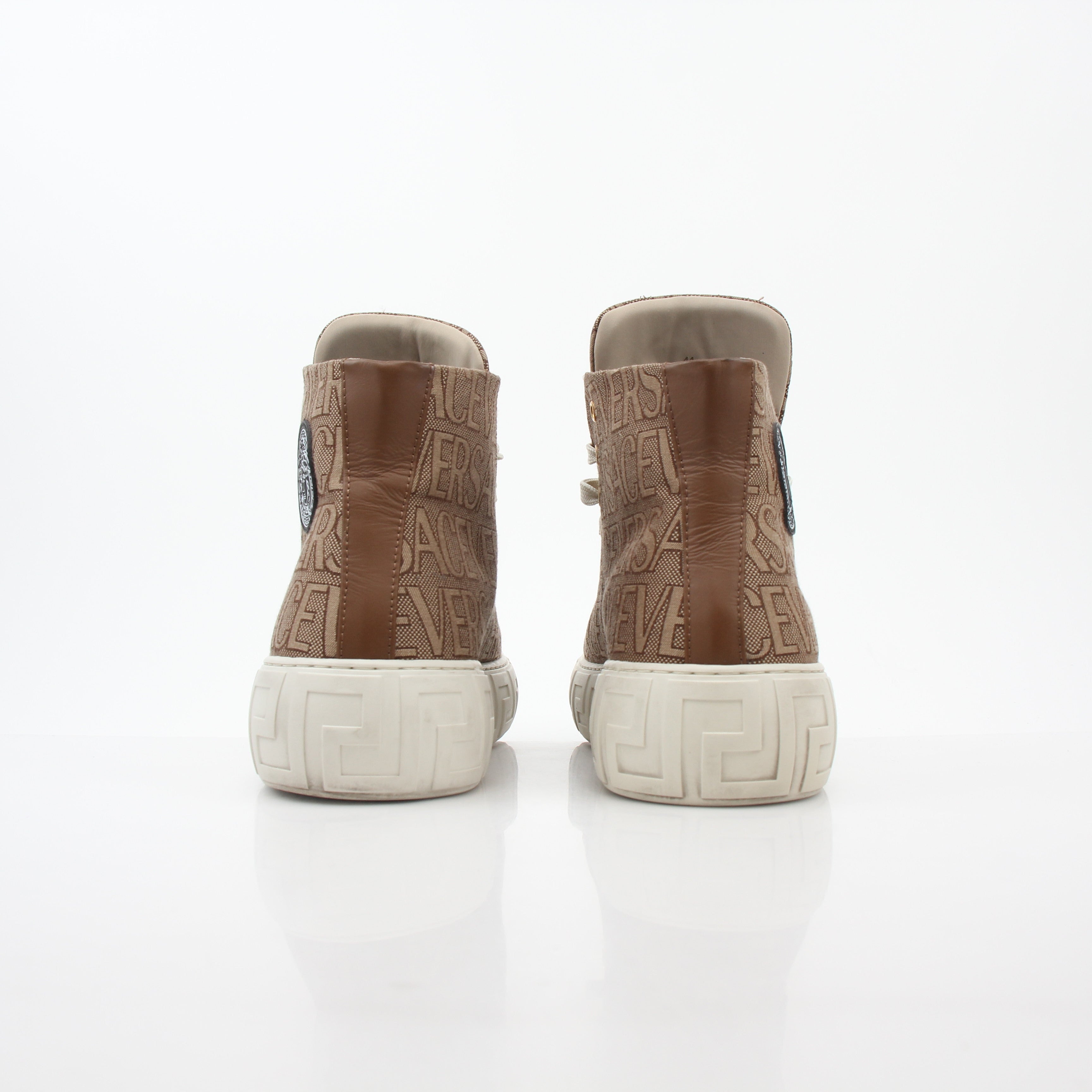 Gold & Beyond Versace brown logo jacquard Greca high-top sneakers with stylish design and iconic branding, shown in close-up shot.