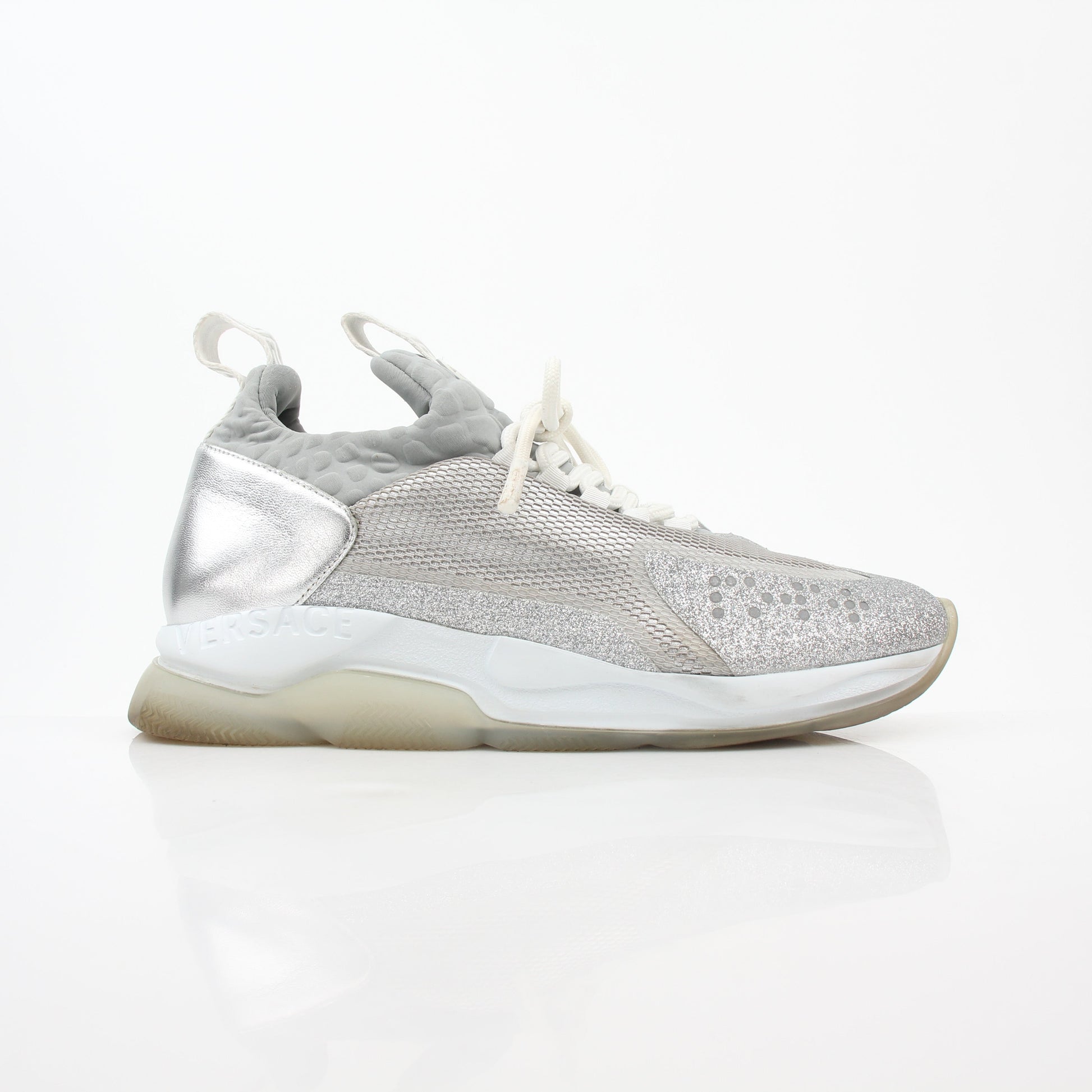 Versace Silver Chain Reaction Glitter Low-Top Sneakers by Gold & Beyond, featuring shiny silver exterior and stylish low-top design.