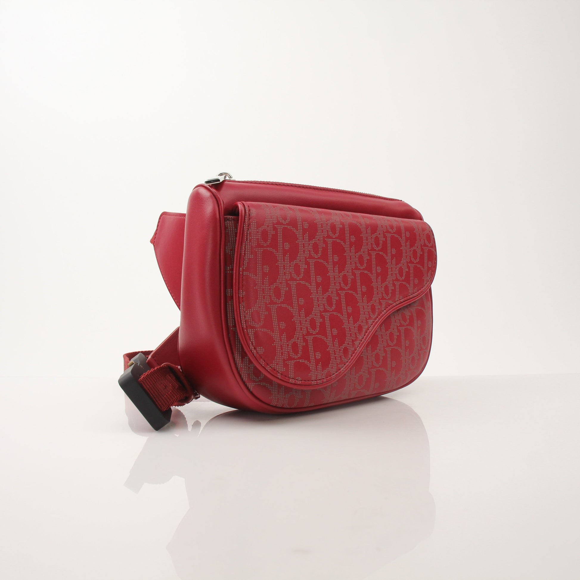 Gold & Beyond Dior Oblique Saddle Belt Bag handbag with adjustable strap and signature monogram print on textured fabric.