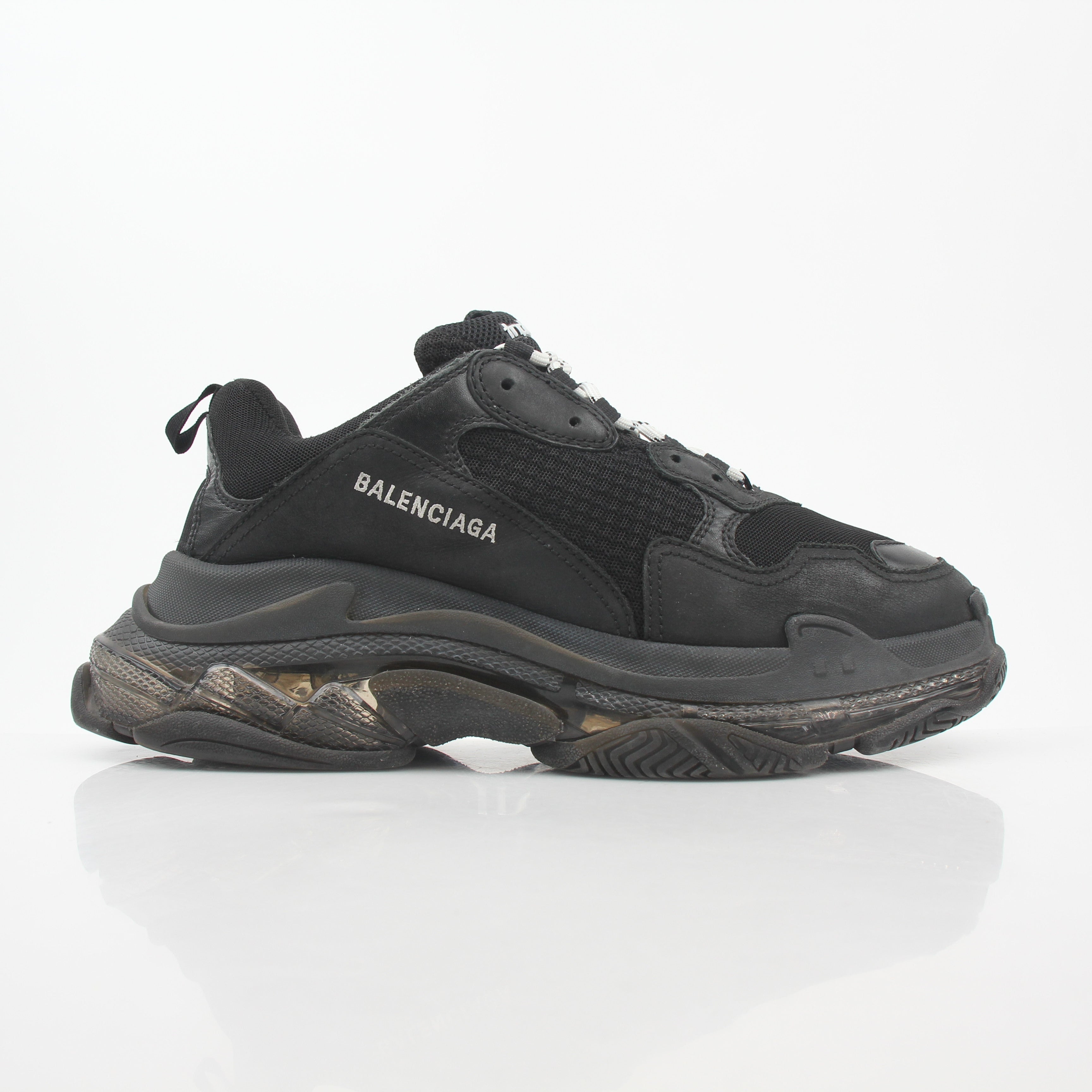 Gold & Beyond Balenciaga Black Triple S sneakers with clear soles, showcasing stylish athletic shoes for casual wear.