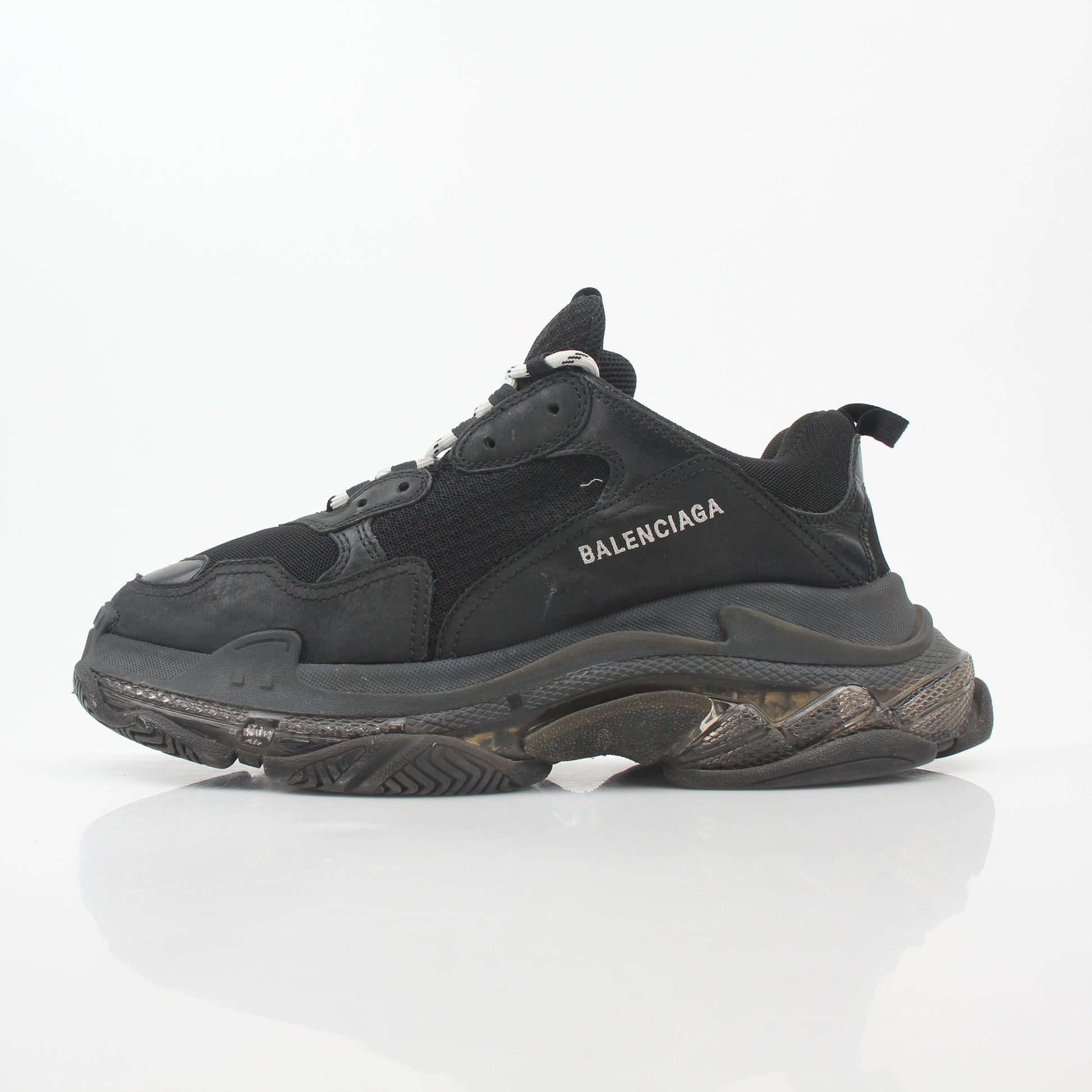 Black Balenciaga Triple S sneakers with clear sole, featuring a chunky design and athletic style, from Gold & Beyond.