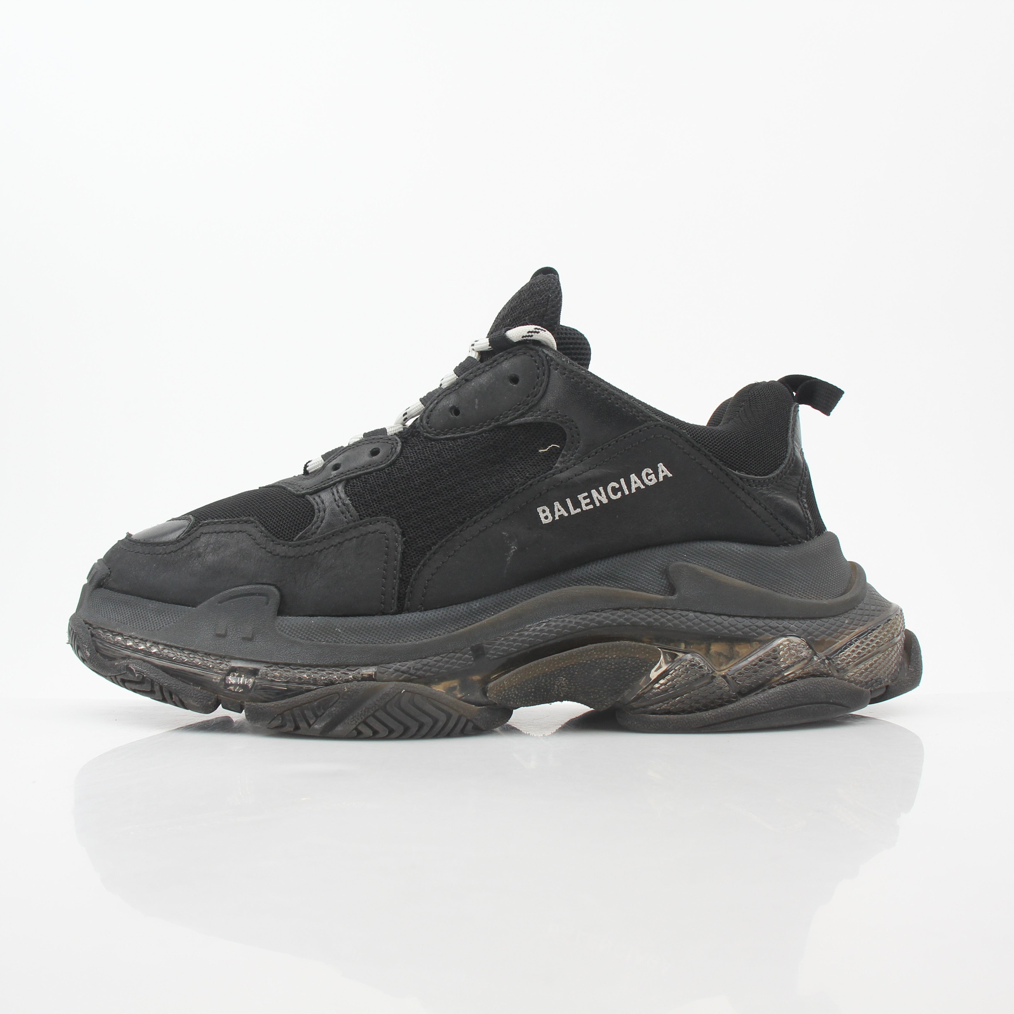 Black Balenciaga Triple S sneakers with clear sole, featuring a chunky design and athletic style, from Gold & Beyond.