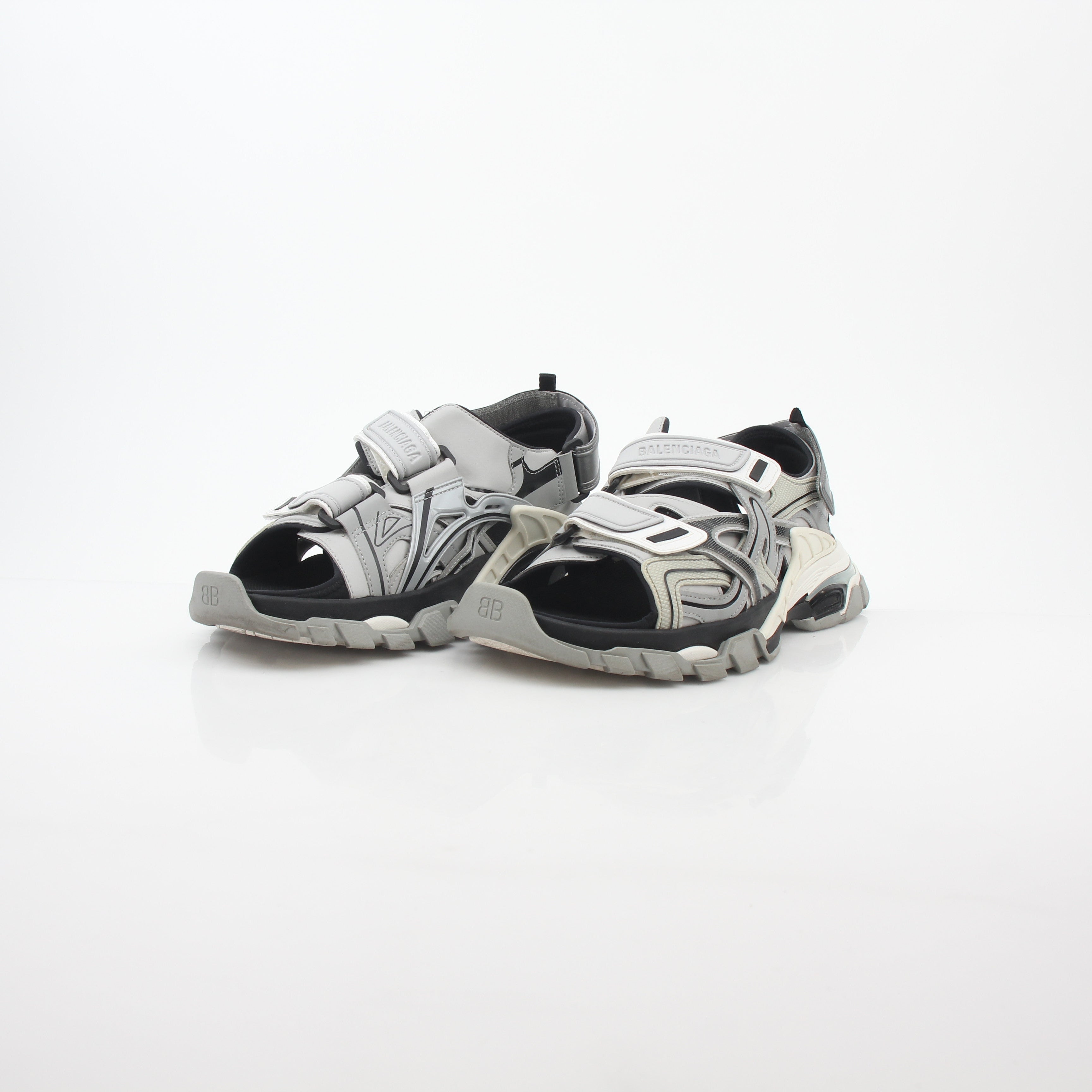 Grey Balenciaga track sandals with sporty design and thick soles, photographed from a side angle.