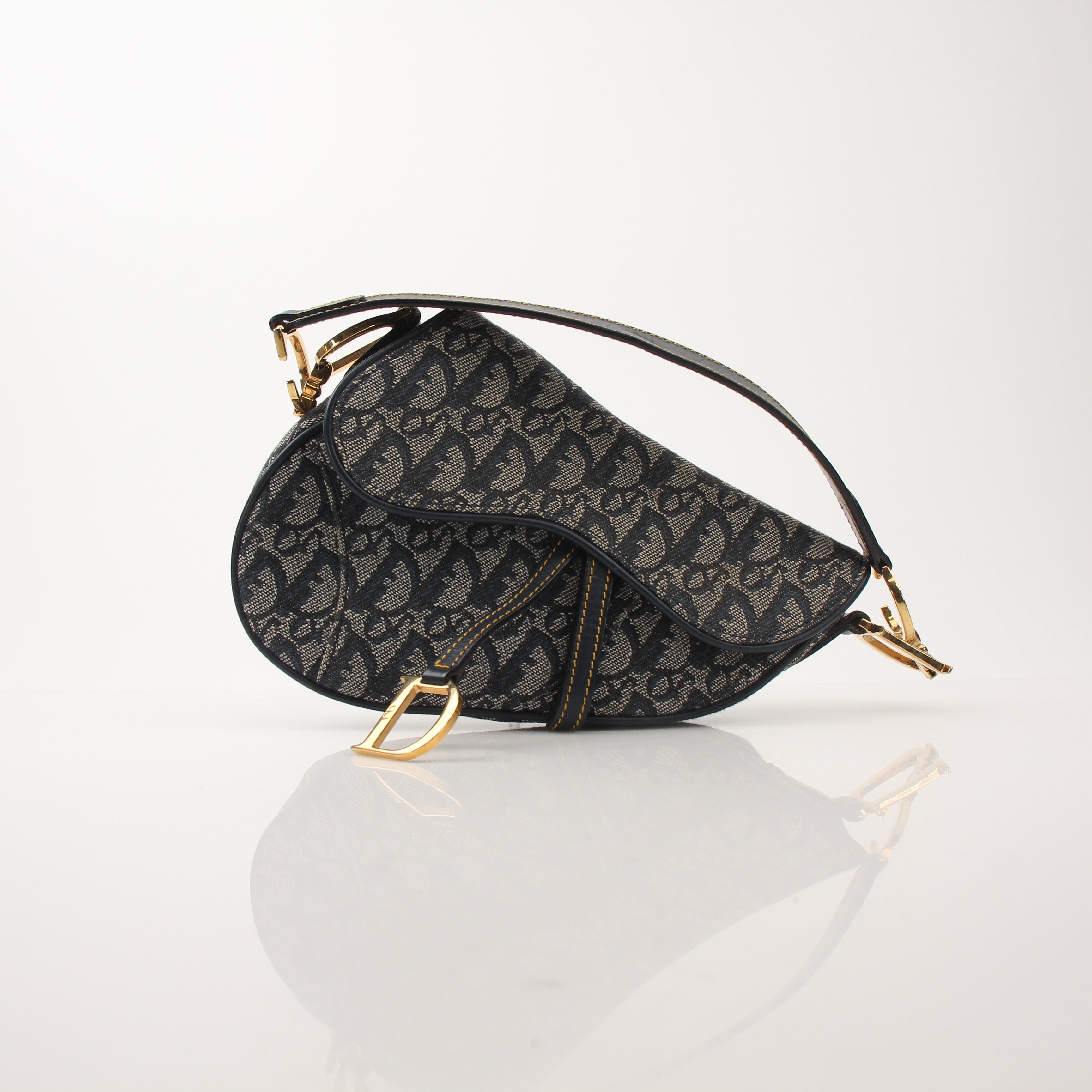 Gold & Beyond Christian Dior Mini Saddle Bag handbag with gold accents, compact design, and signature Dior style.