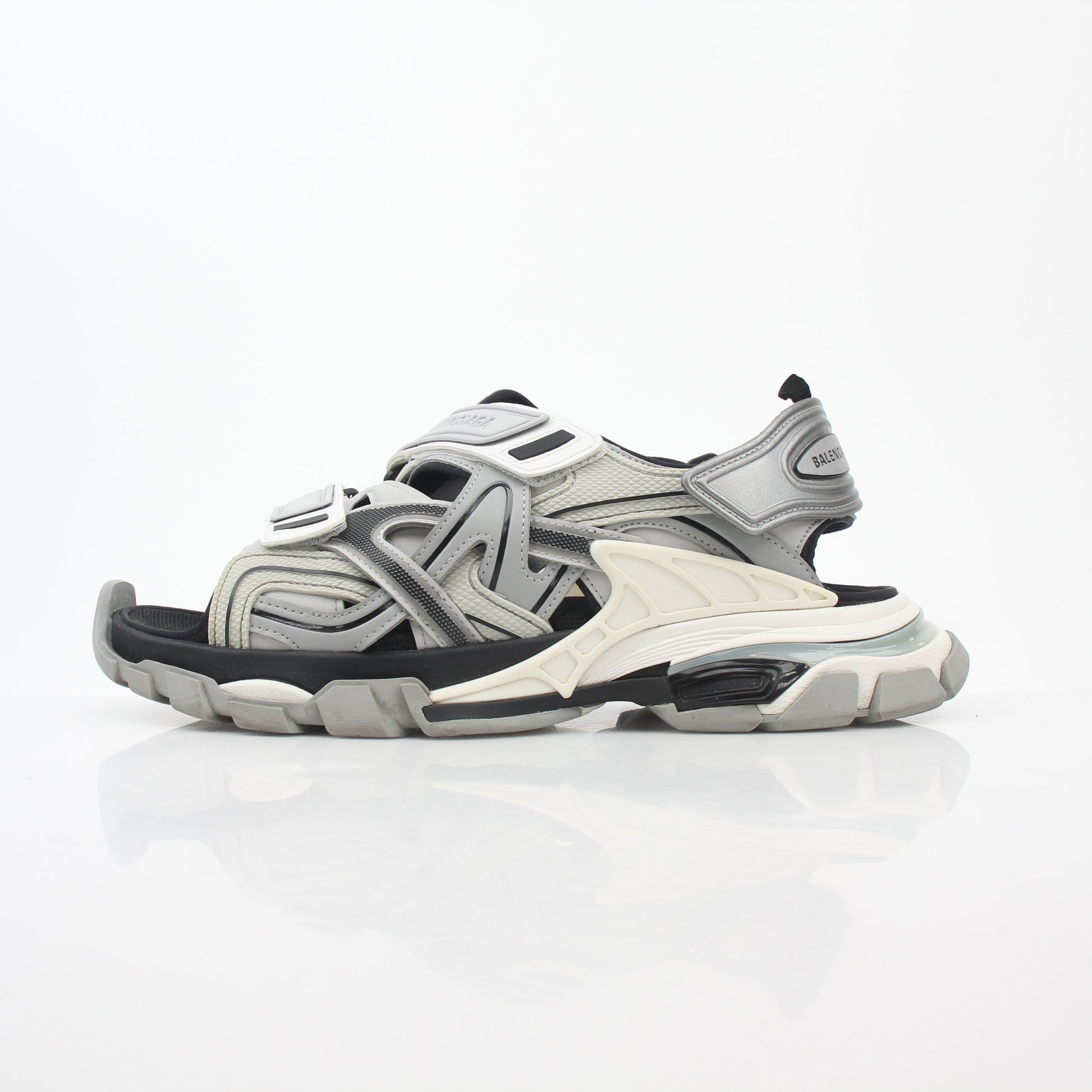 Balenciaga grey track sandals with sporty design and open toe, displayed on a neutral background.